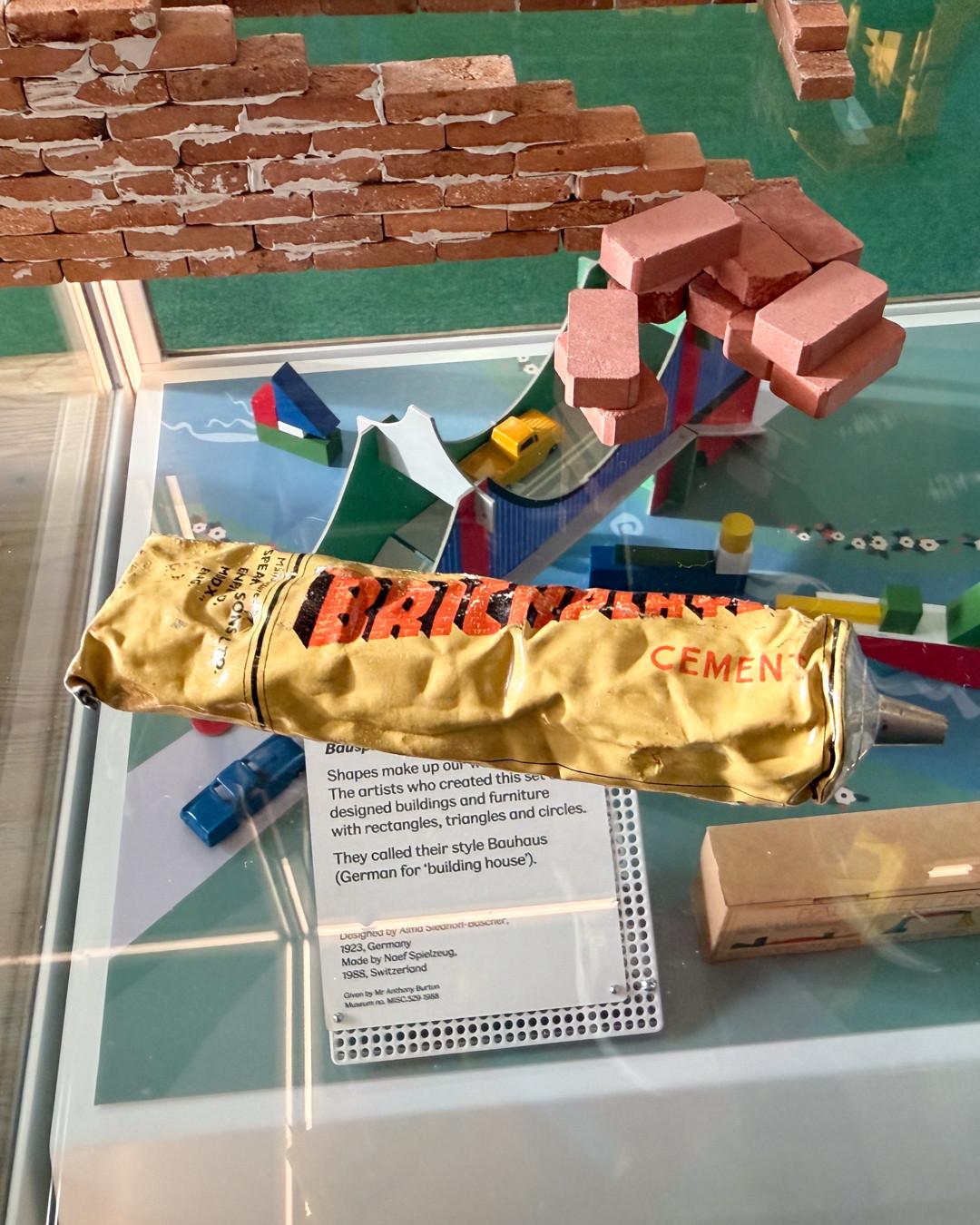 A view of the tube of cement used to join the tiny bricks.