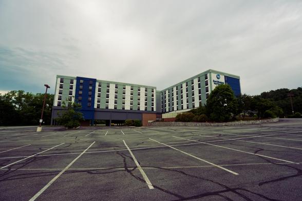 Block hotel building with vertical blue, white and grey stripes