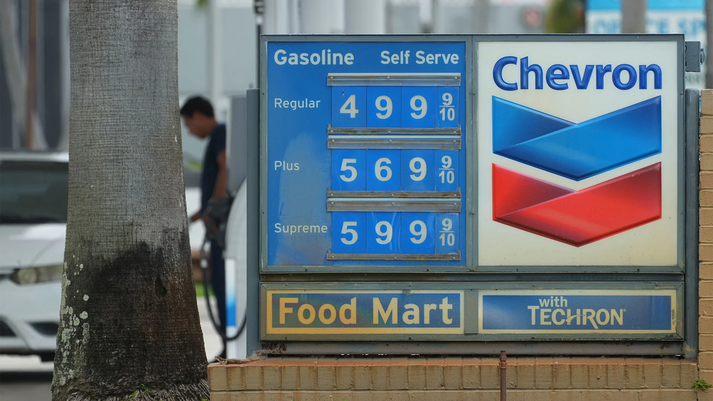 A customer pumps gas at a Chevron station Wednesday, May 27, 2026, in North Miami, FL
