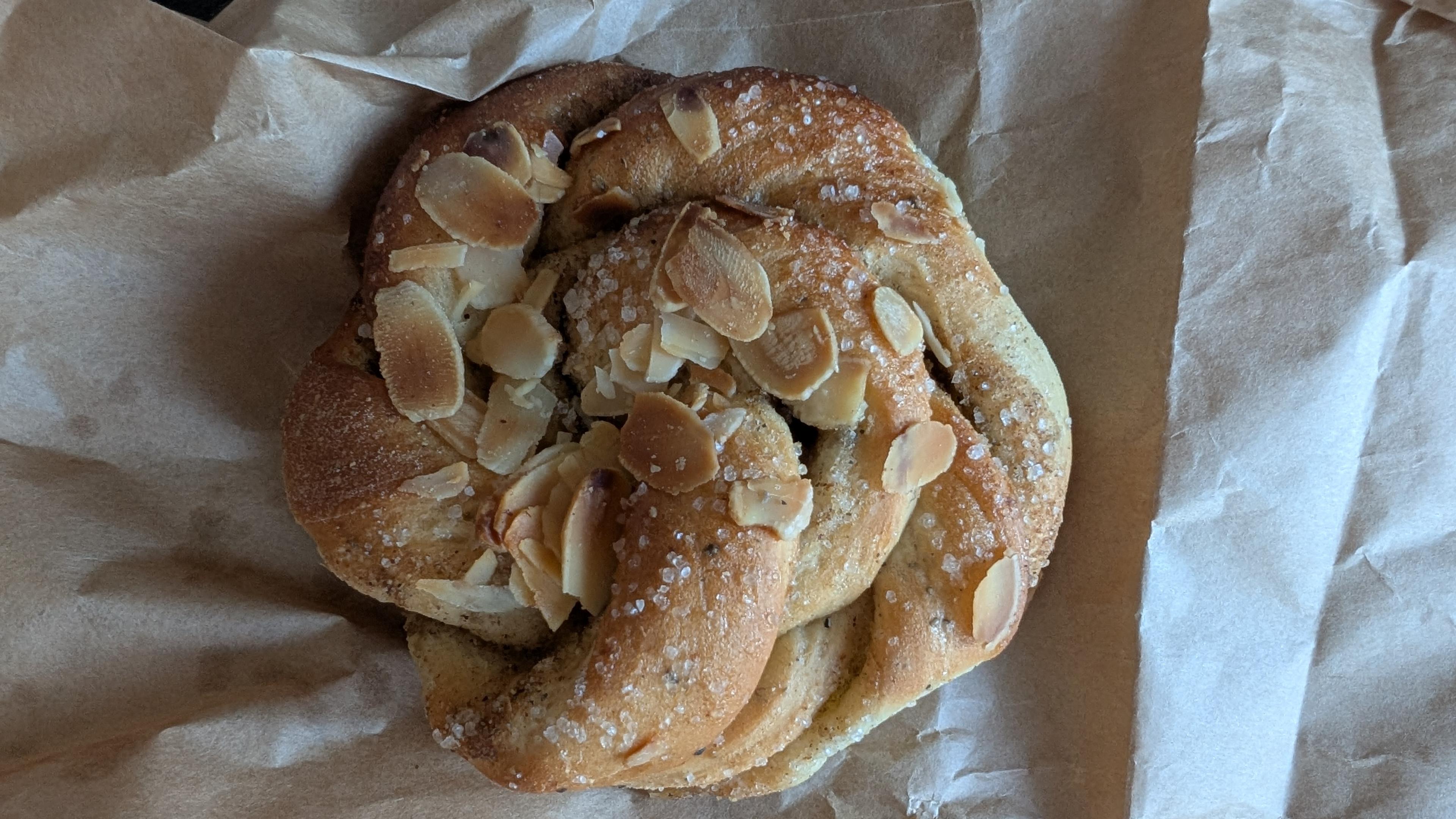 A cardamom bun on a paper bag