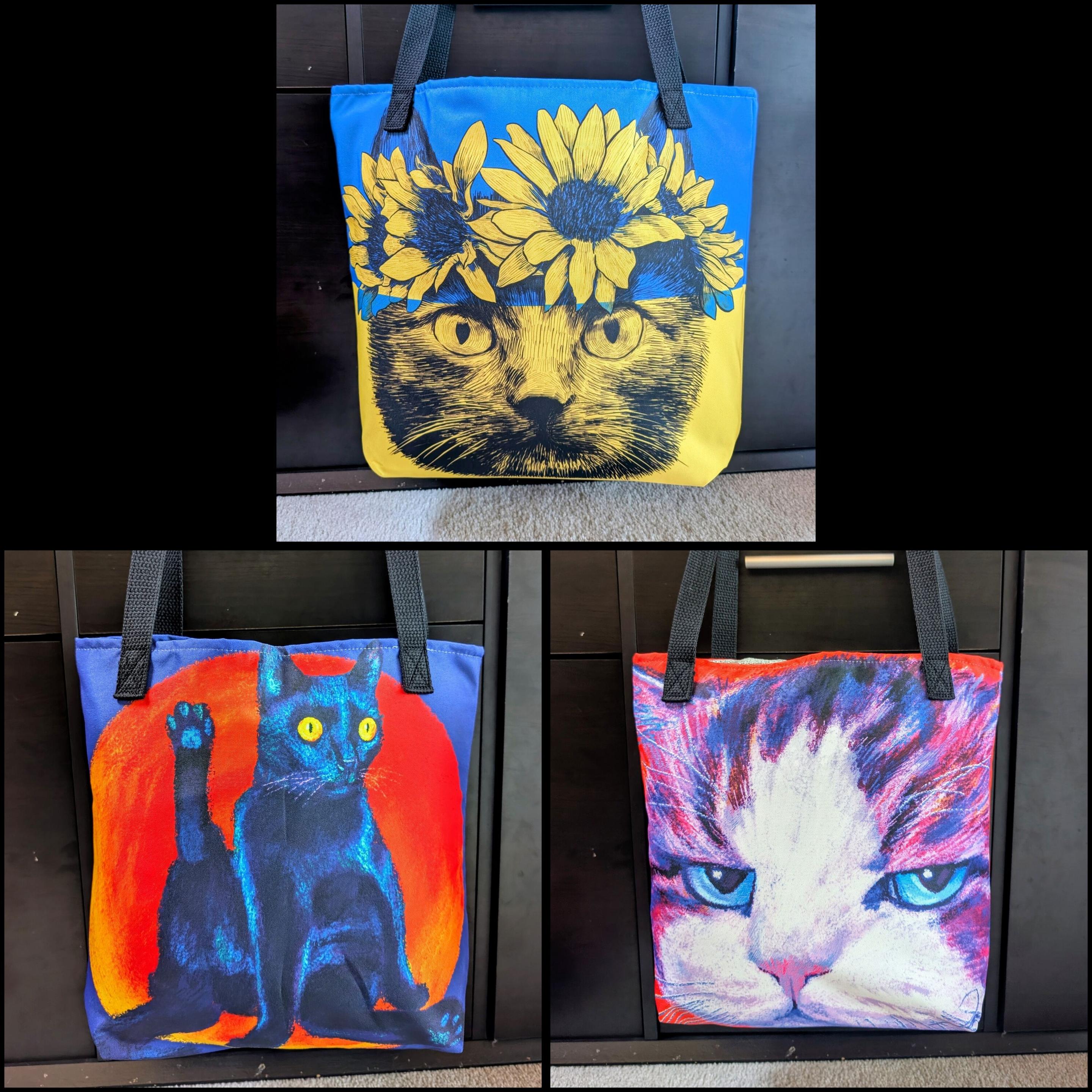 Three photos of tote bags. The top photo is of the art piece "Cat of Ukraine," a drawing of a Ukrainian cat with a crown of sunflowers in the Ukrainian flag colors. The bottom left photo is of the oainting "Excuse Me," a black cat with vacant yellow eyes sitting with his right hind leg raised up in the air. Behind it is an orange circle. The right is of the painting "Disappoint," a close up of a purple and white with a very disappointed look.