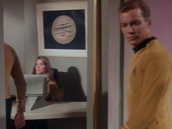 Star Trek, the original series. Kirk is about to go through a door. Seated at a desk on the other side is a woman, on the wall behind her is a Trouvelot print of Jupiter