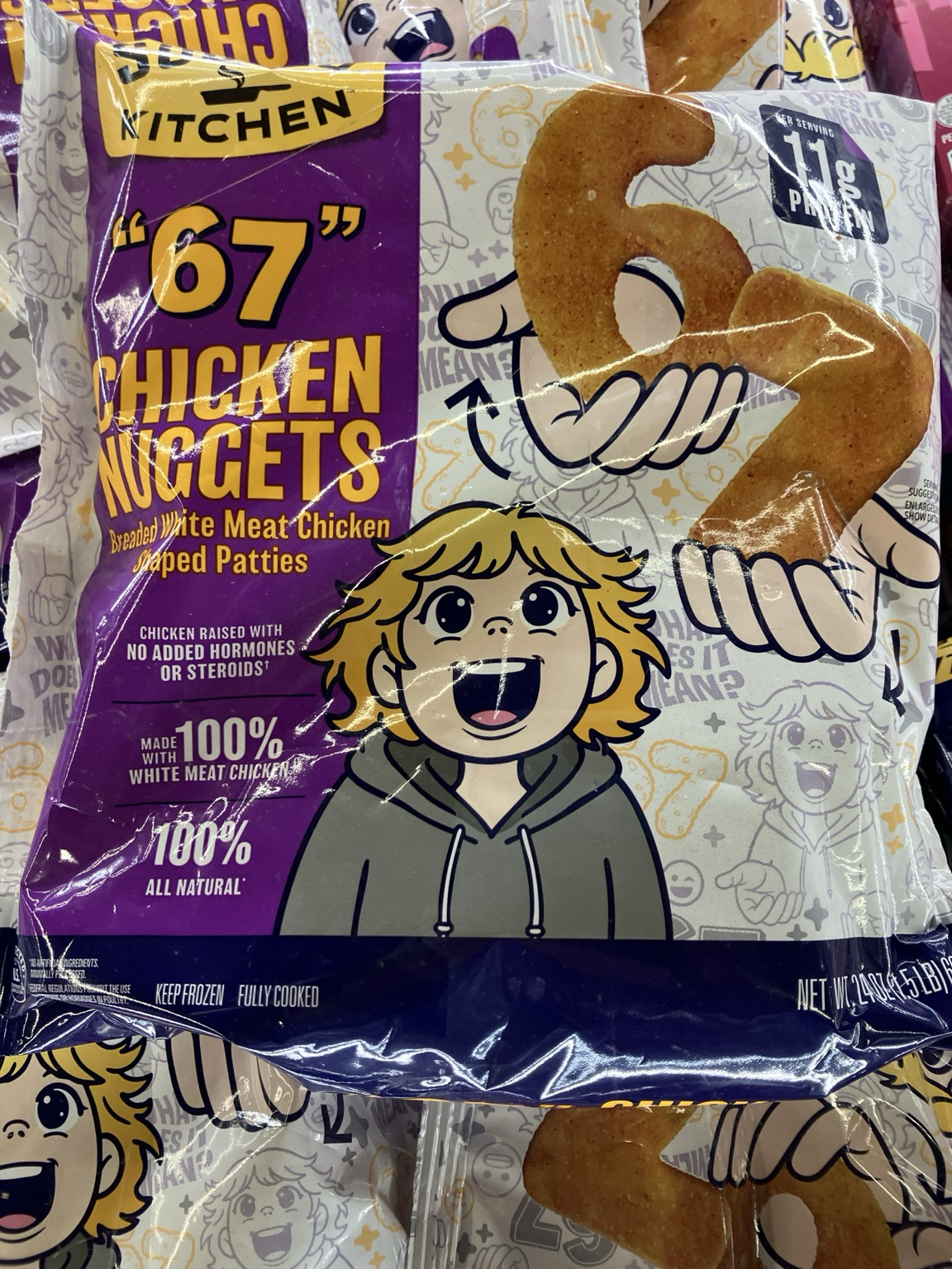 A bag of “6 7” chicken nuggets. They are chicken nuggets shaped like the numbers six and seven, referencing the meme. The package also features art of a wide-eyed blonde kid in a hoodie 