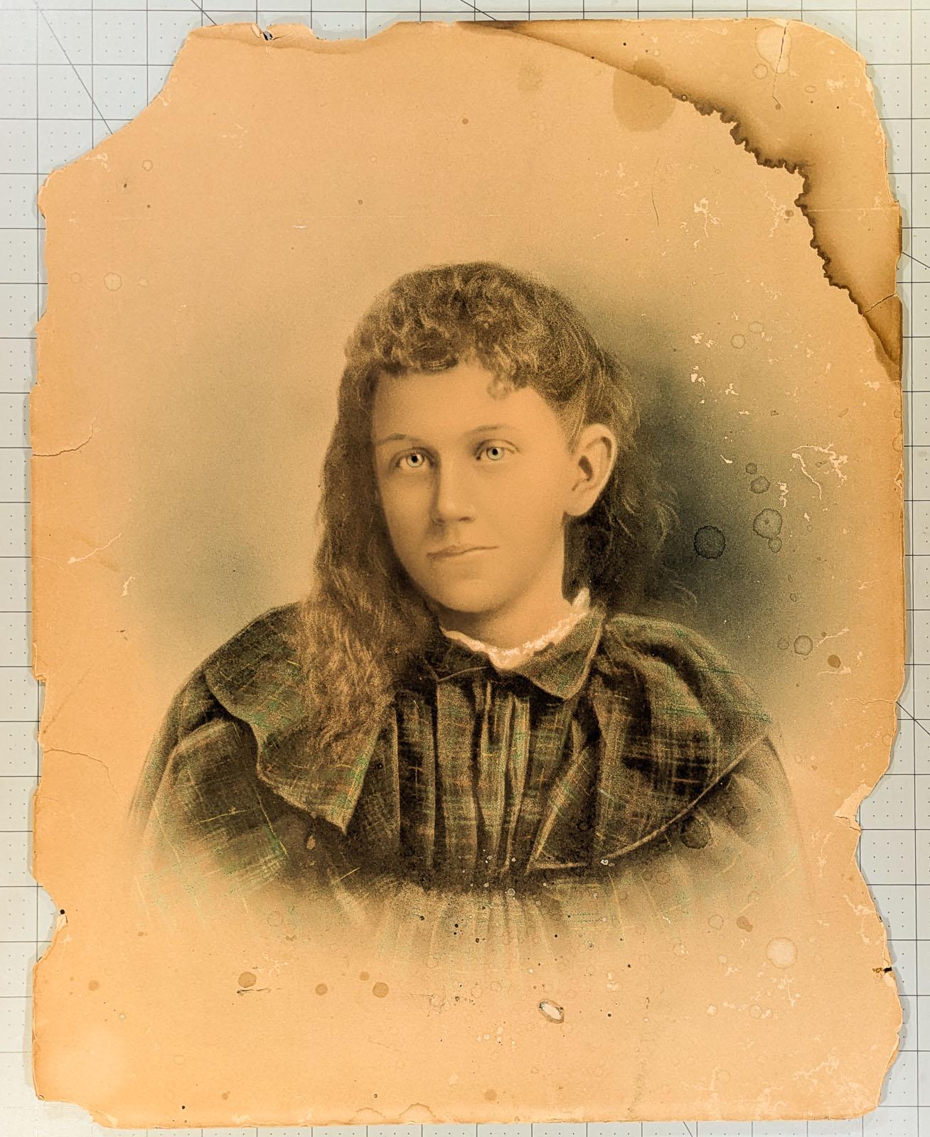Antique crayon portrait of a young girl in a plaid dress