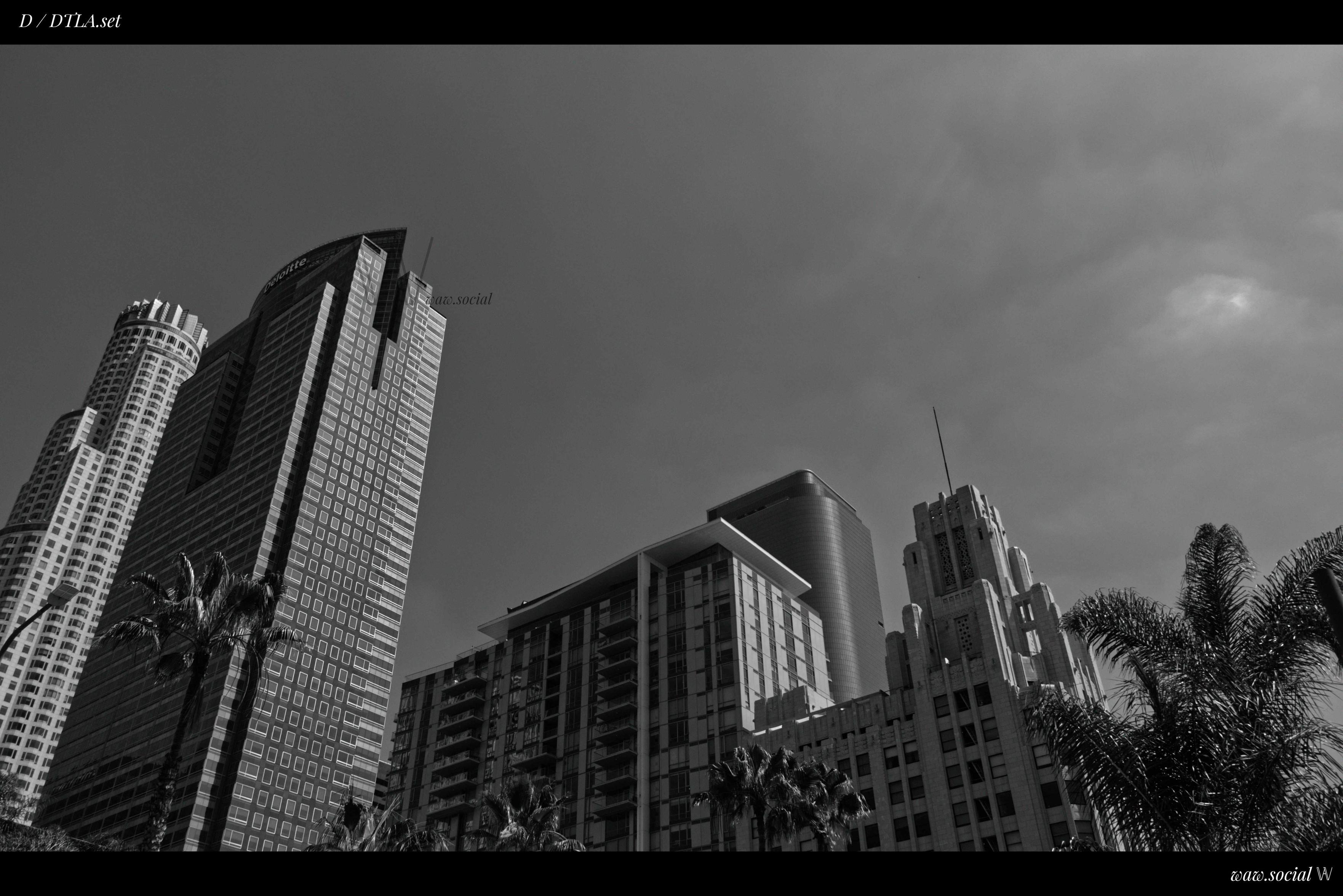 A black and white photo of buildings in Downtown Los Angeles with the US Bank Tower and Gas Company Tower in frame.