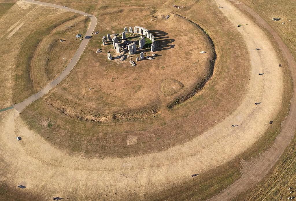Parched grassland surrounds Stonehenge.