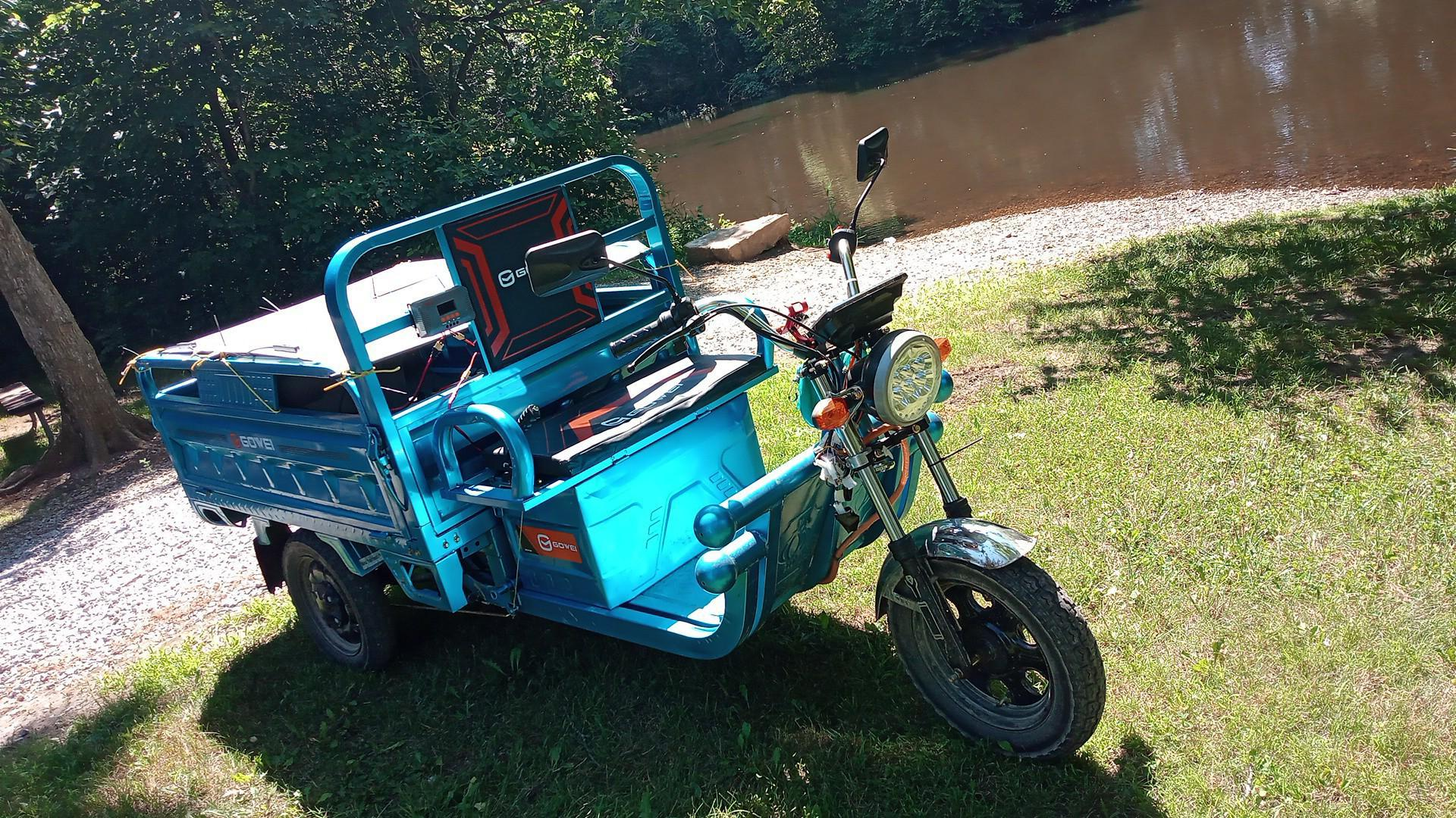 Bright blue electric bengbeng trike-truck (20mph max but it never gets that fast)
