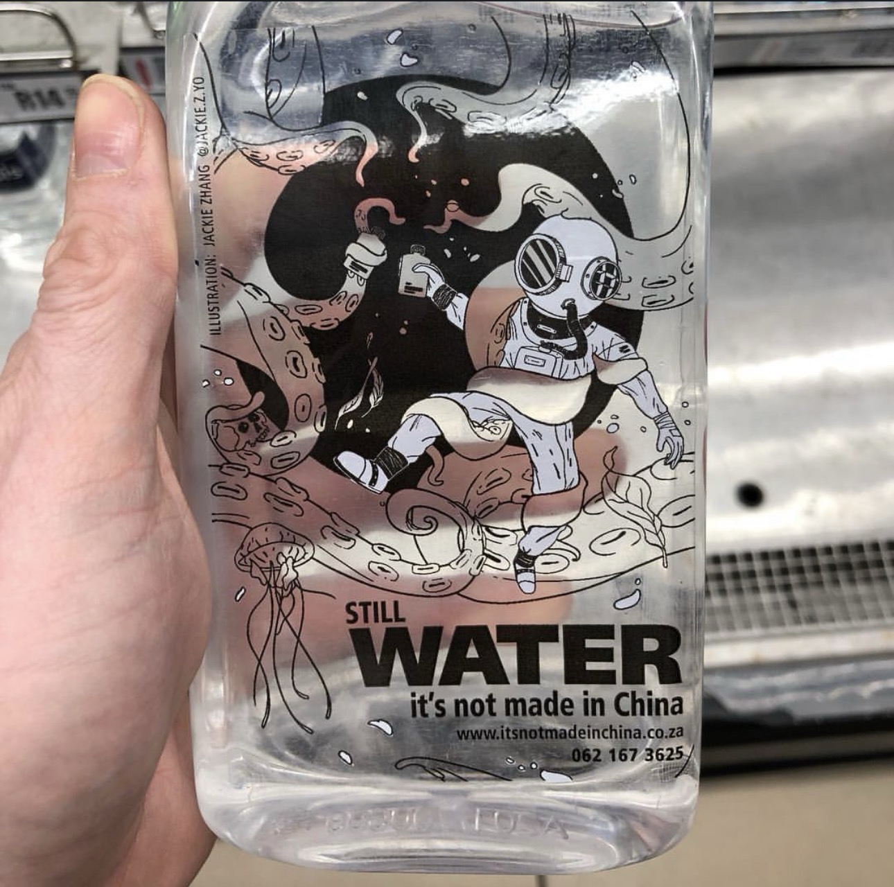 Packet water with picture depicting an alien underwater with written texts STILL WATER NOT MADE IN CHINA