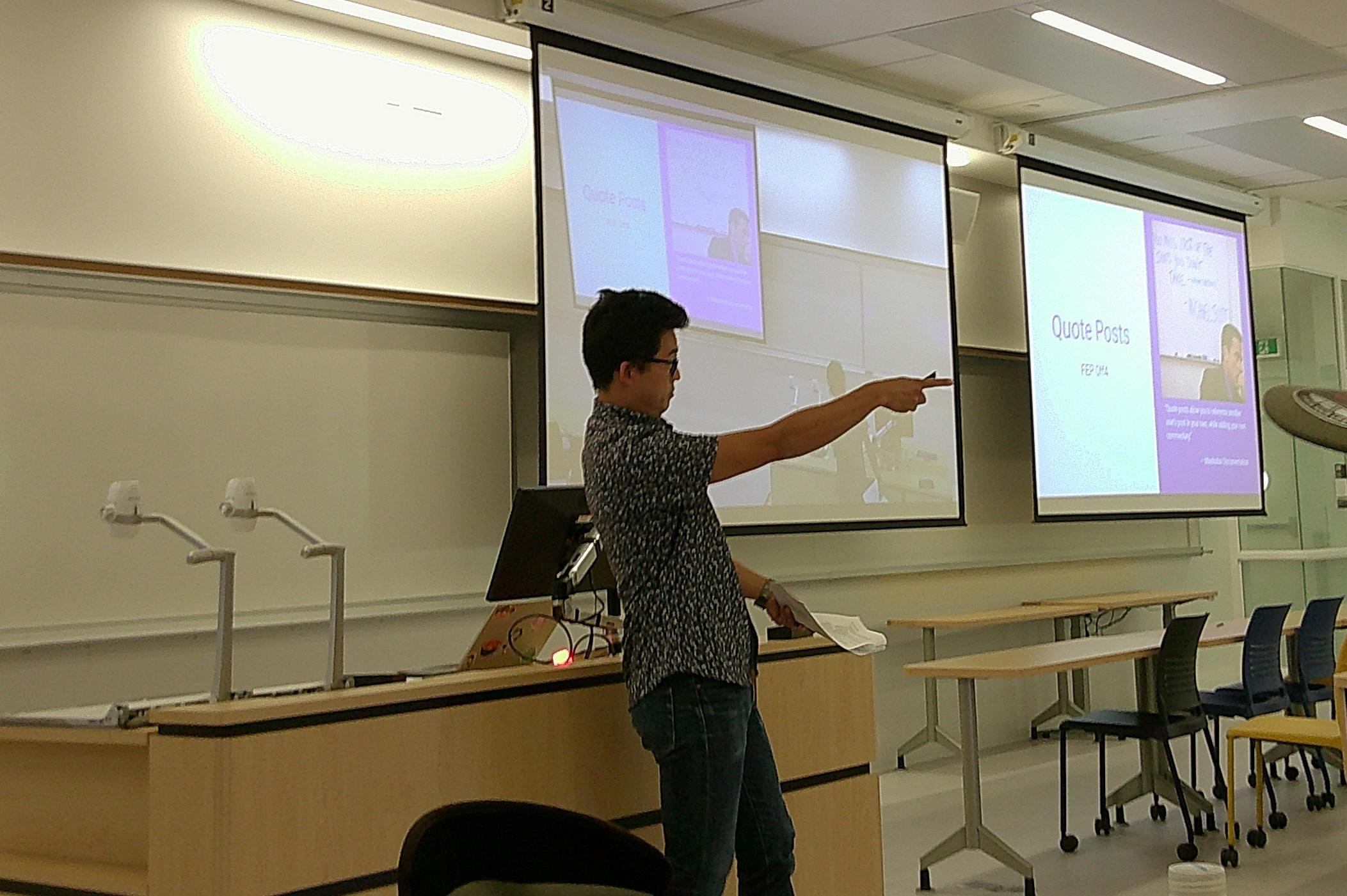 Julian pointing at someone, but looks like hes pointing at the Quote Posts slide