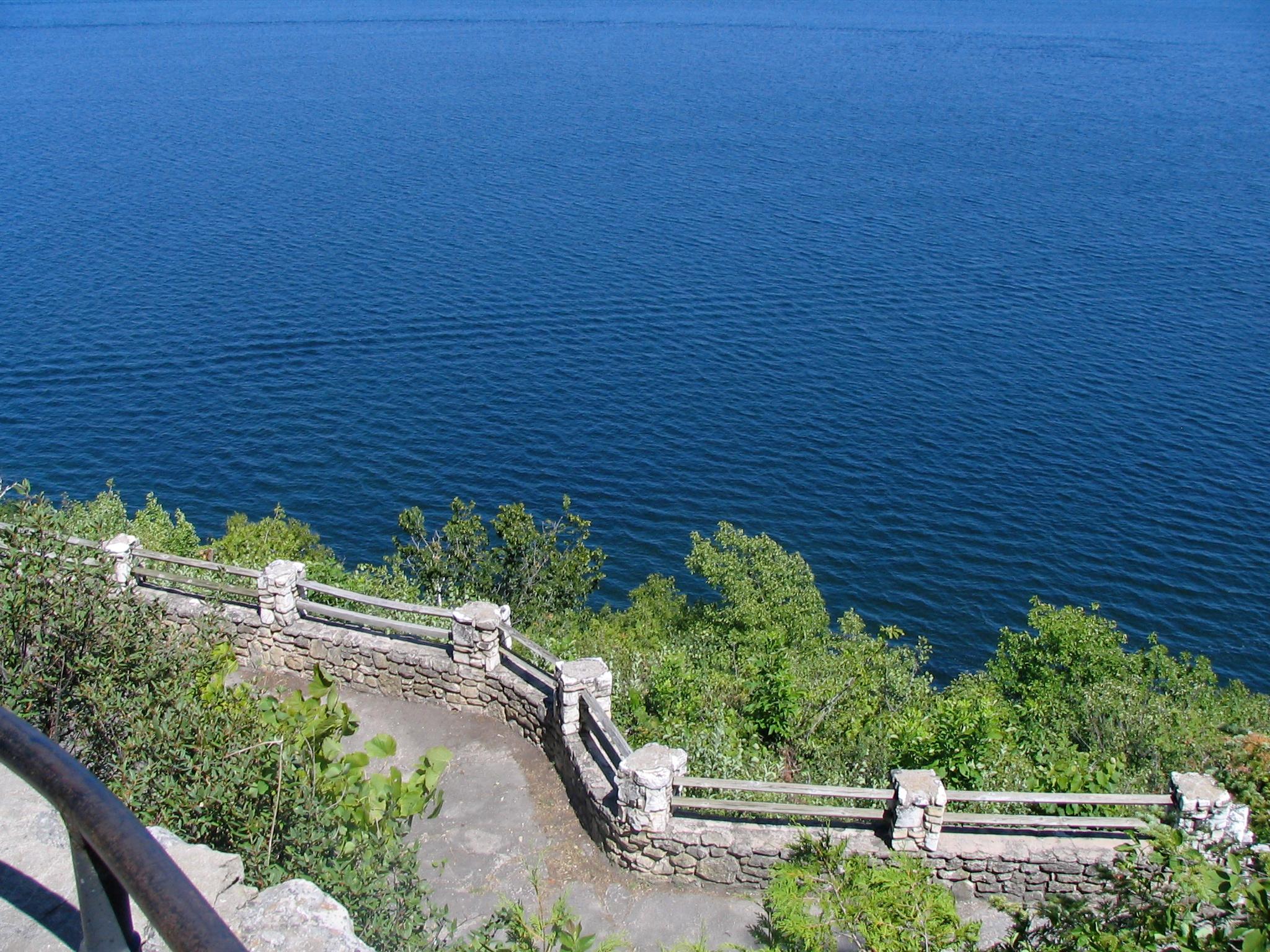 Near the top of the steps looking down to Eagle Terrace and the very blue water of Eagle Harbor near Ephraim, Wisconsin (some years ago).