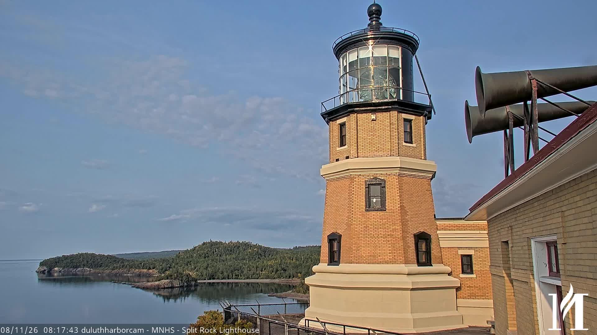 View looking west of the Split Rock Lighthouse sitting on the rugged shoreline of Lake Superior. // Image captured at: 2026-08-11 13:18:14 UTC (about 1 min. prior to this post) // Image sourced from: youtube.com/@DuluthHarborCam1 // Current Temp in Two Harbors: 62 F | 17 C // Precip: clear sky // Wind: NW at 3 mph | 4 kph // Humidity: 85%