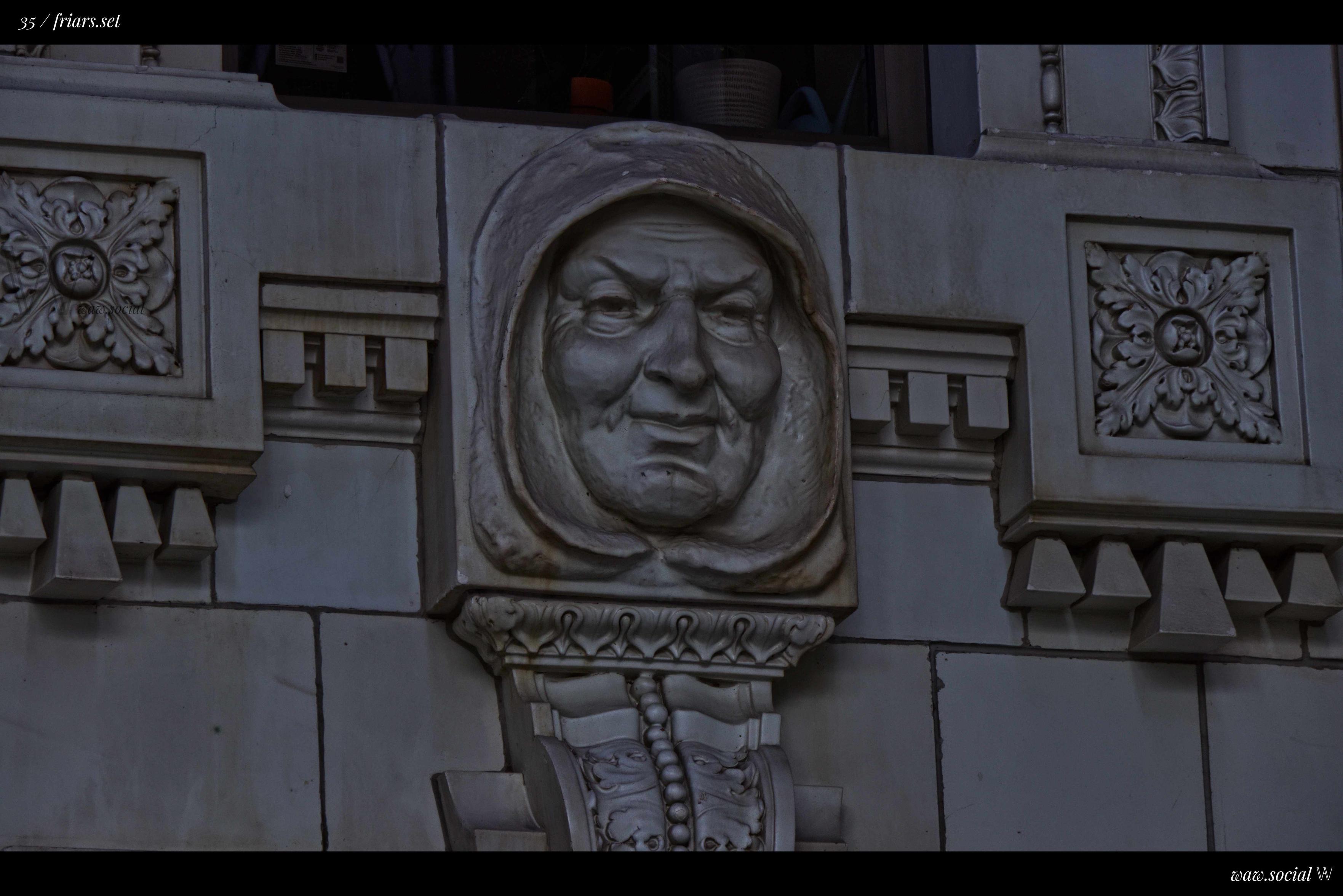 A color photo of one of the Friars Head Sculptures found on Ventrua CIty Hall in the city and county seat of Ventura, California.