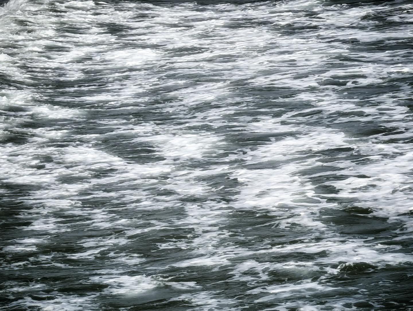 Digital photo of the waves breaking in Oceanside Harbor in Oceanside California. The white foam on gray water looks very much like oil painting.