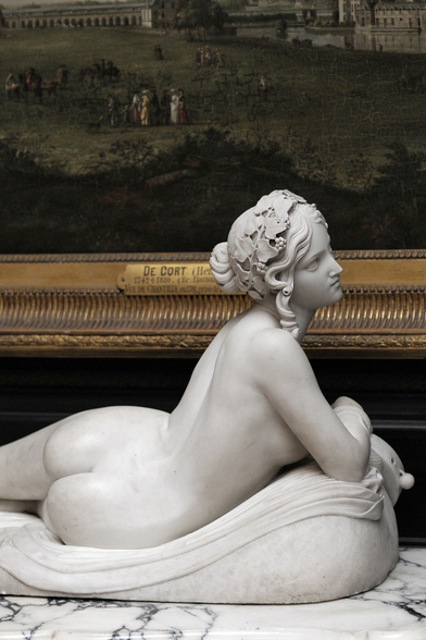 Reclining Bacchante, 1834 marble sculpture by Lorenzo Bartolini (Italian, 1777 – 1850), today in the Musée du Louvre, Paris.
The reclining Bacchante is photographed from behind, showing off her gorgeous back and backside. She is reclining on a marble mattress or cushion, her curly hair styled in a bun at the back of the head, with an ivy wreath adorning it.