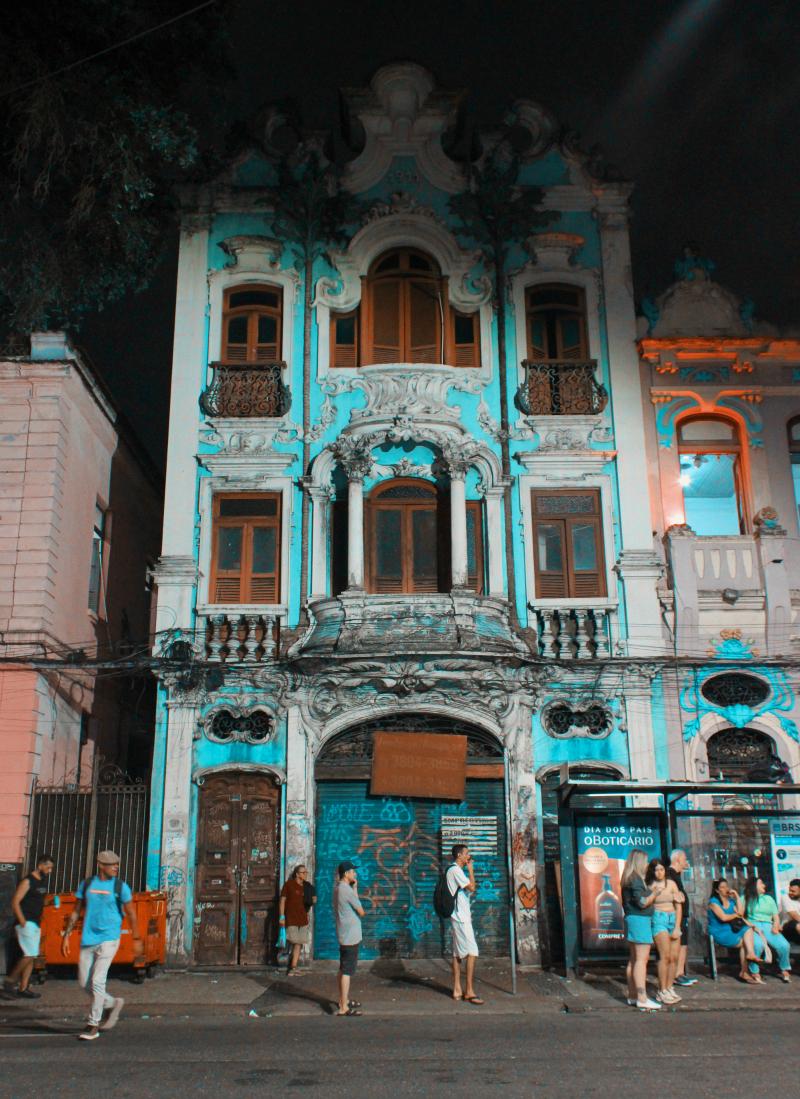 Tall three stories building by night at Lapa with aqua colors