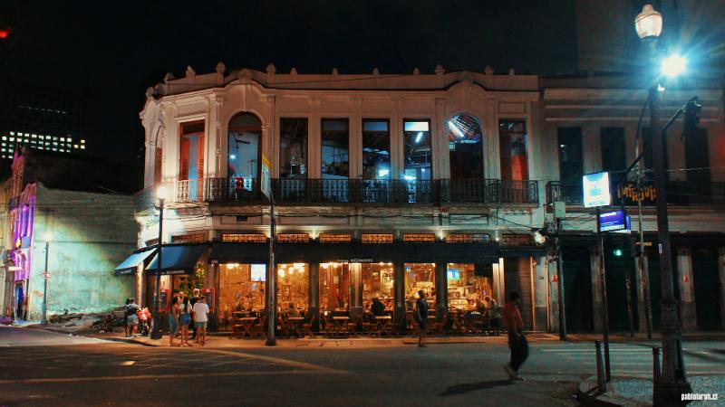 Two stories Restaurant in Lapa illuminated by the interior lights.