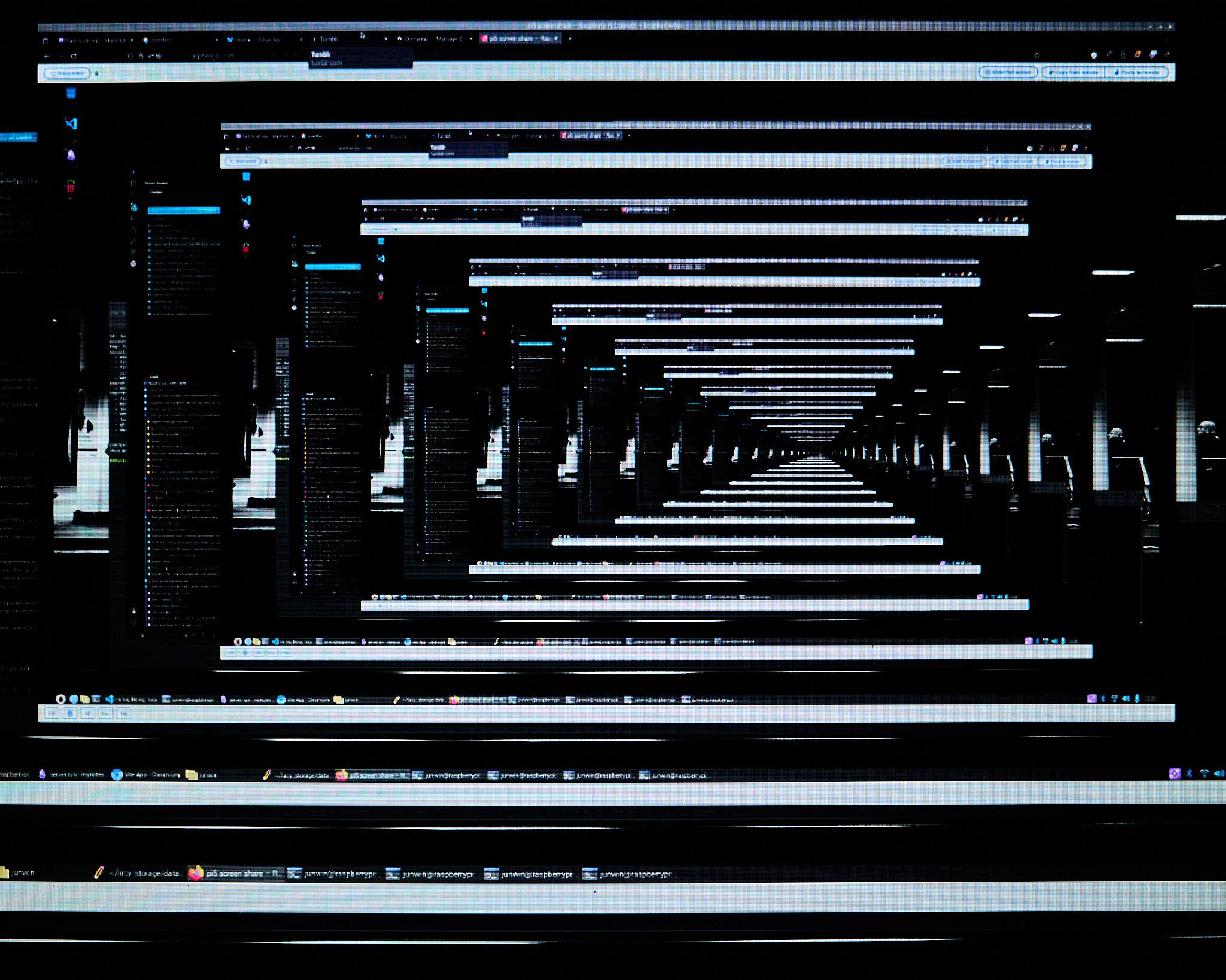 An abstract image depicting multiple computer screens displaying the same content, creating a tunnel effect. The screens are arranged in a repeating pattern, with dark backgrounds and visible text on each screen. The foreground shows the bottom edge of a monitor with application icons and a taskbar.