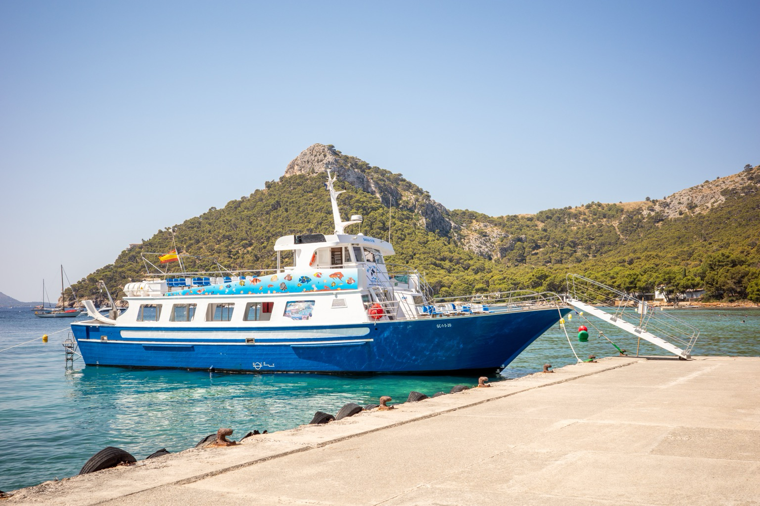 A boat docked at Platja de Formentor