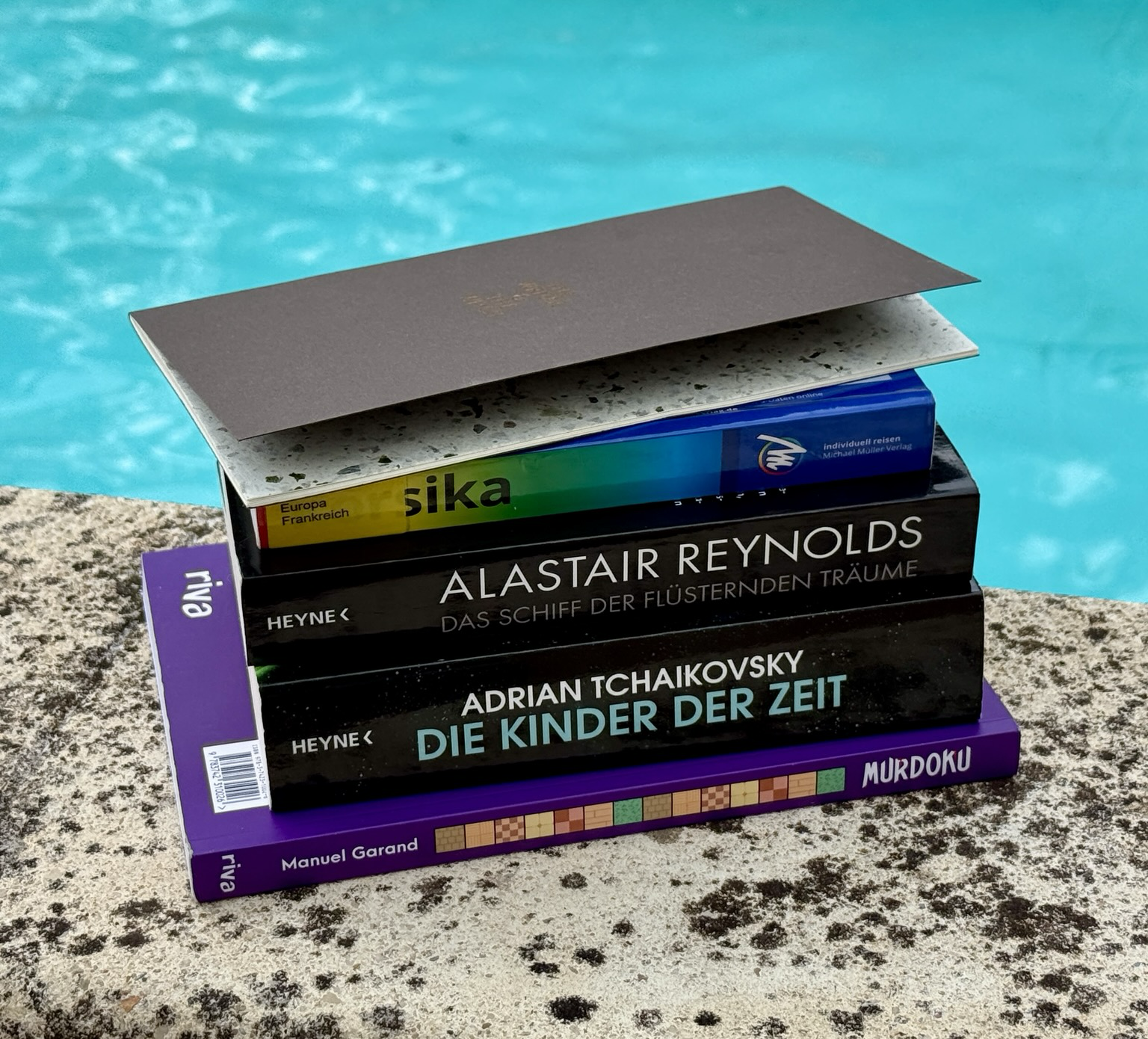 Summer holiday reading stack: This is what I packed for the holiday in Milan and Corsica this year. Not that I ever t...