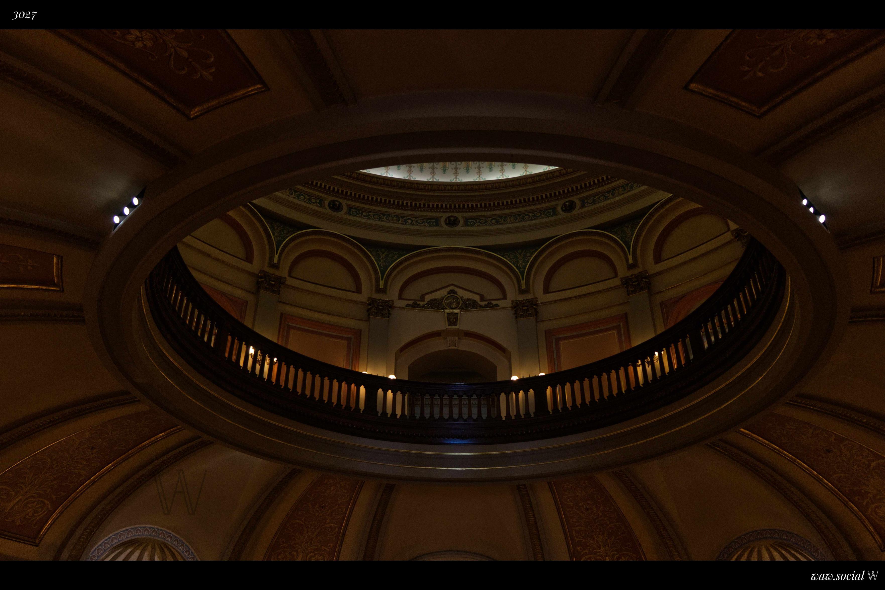 A warm color photo of the interior of the Capitol of California in Sacramento, California.