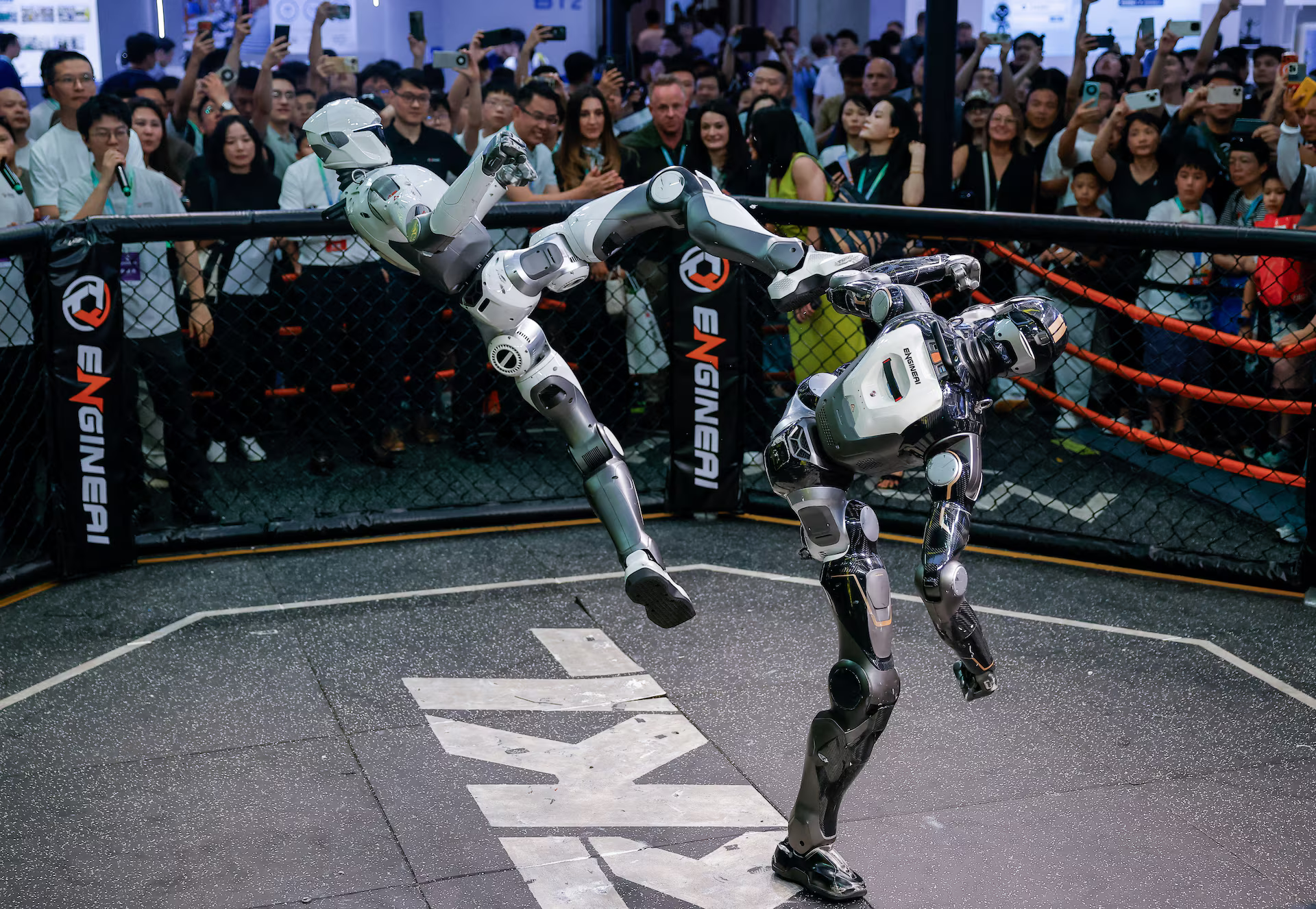 Robots fight during an MMA-style performance.