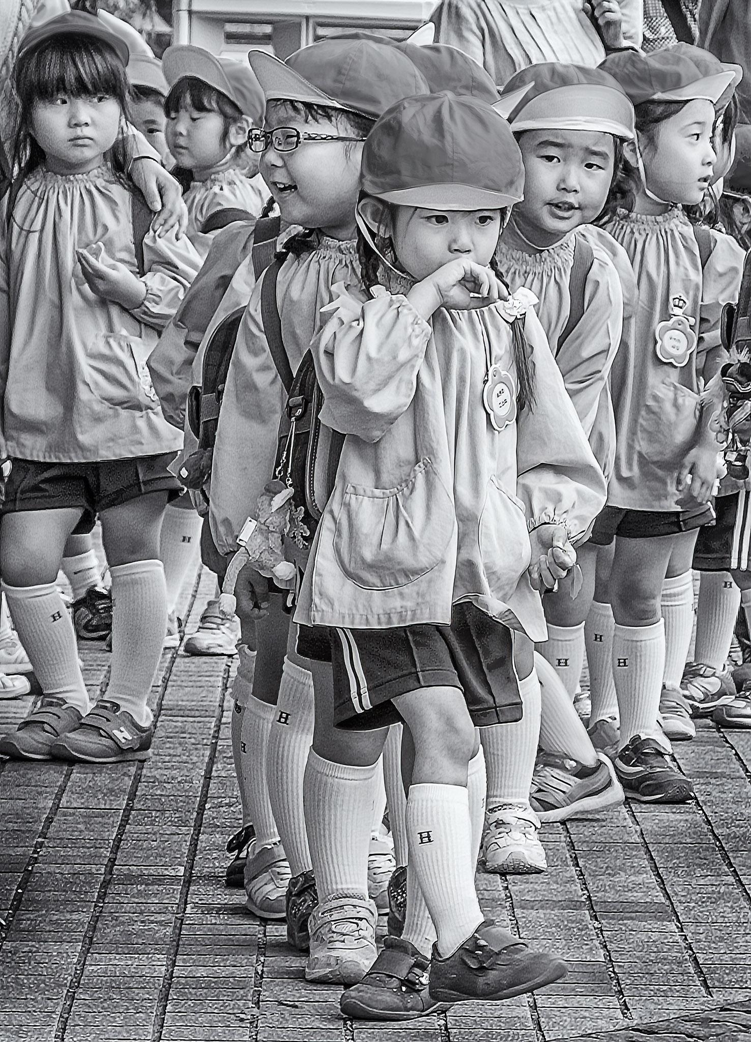 Group of kindergarten kids out for a field trip in Ueno Park in Tokyo, Japan.
