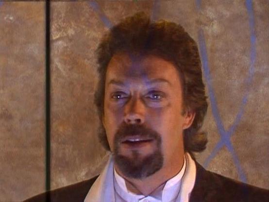 Picture of Tim Curry from the Lexx episode “Super Nova” looking dapper in a tuxedo