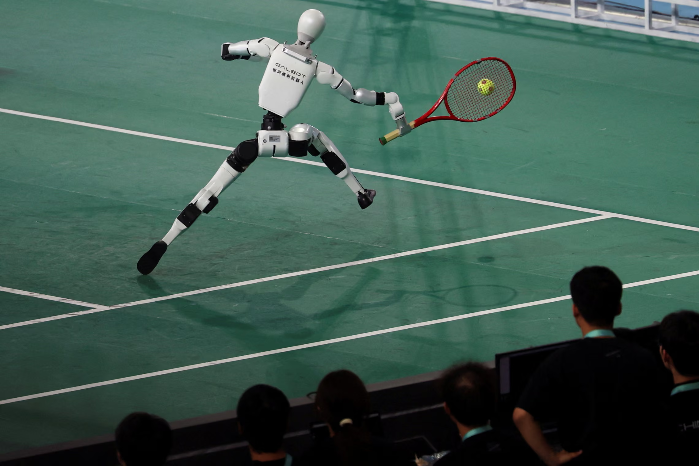 A Galbot humanoid robot takes part in a tennis exhibition match.