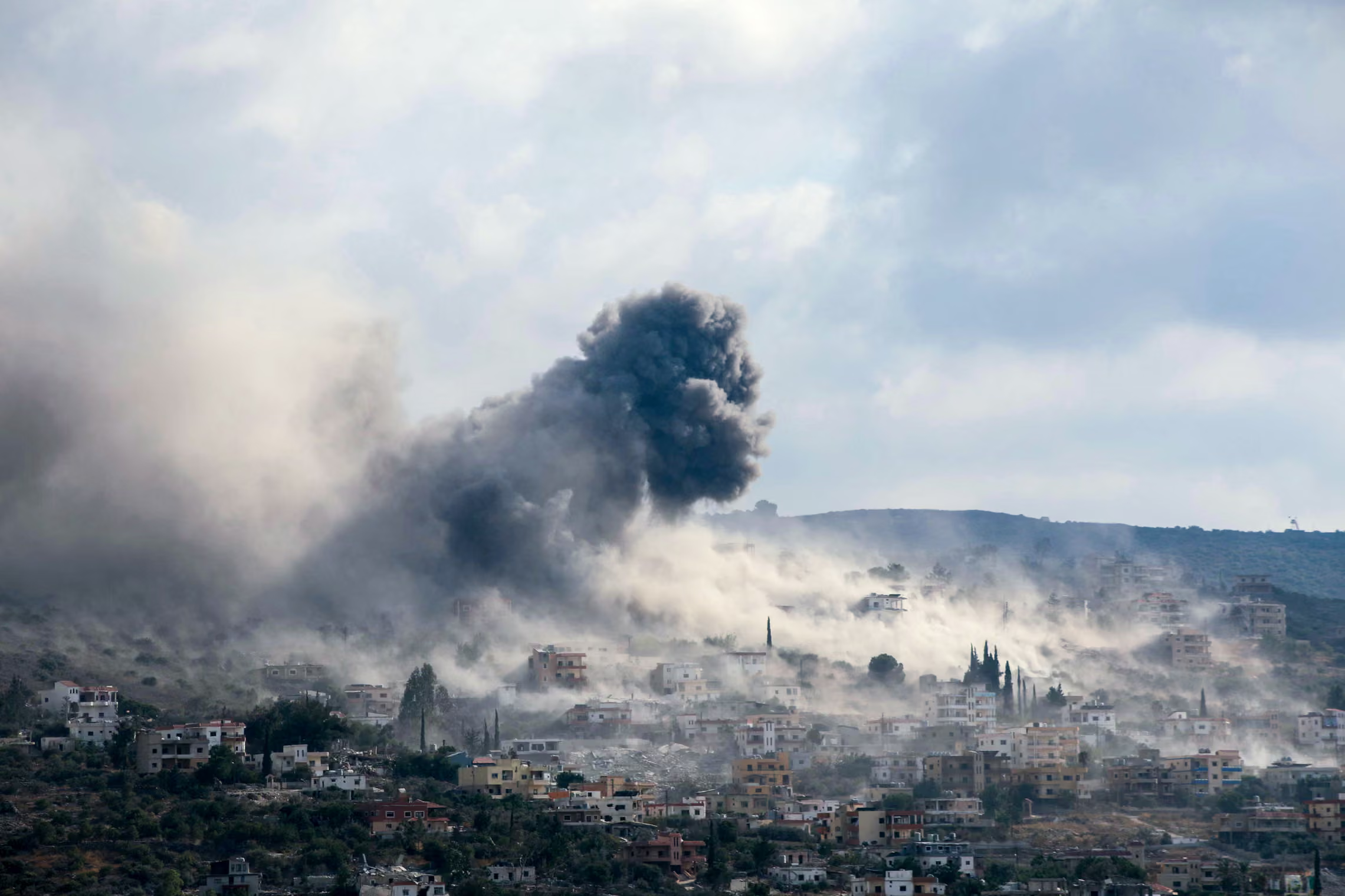 Smoke rises from the site of several Israeli airstrikes.