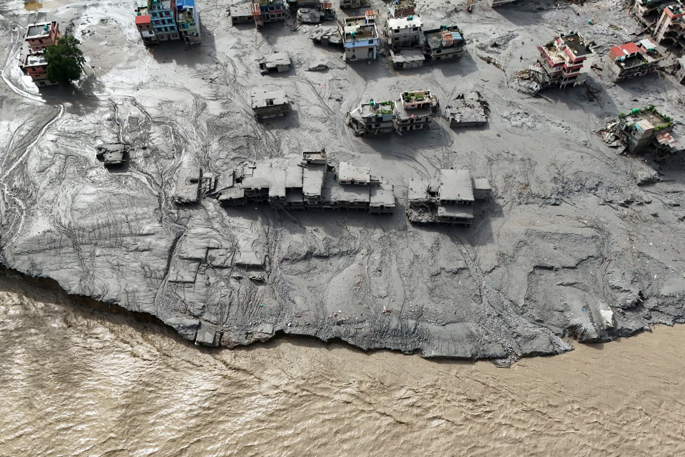 Mud covers buildings following devastating floods.