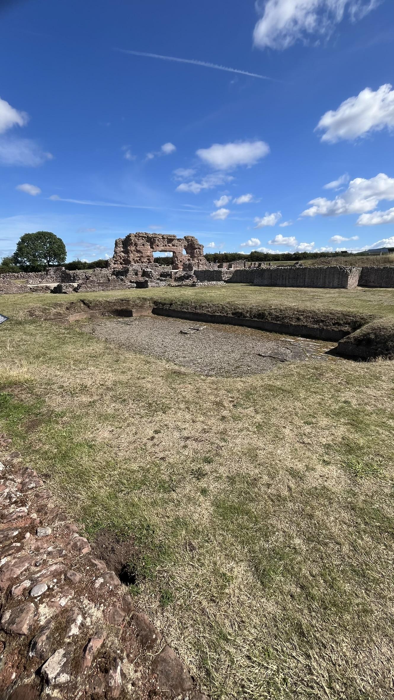 A photo of "The Old Work" a 7m high piece of Basilica wall., This is the largest piece of  free-standing Roman wall in the country.