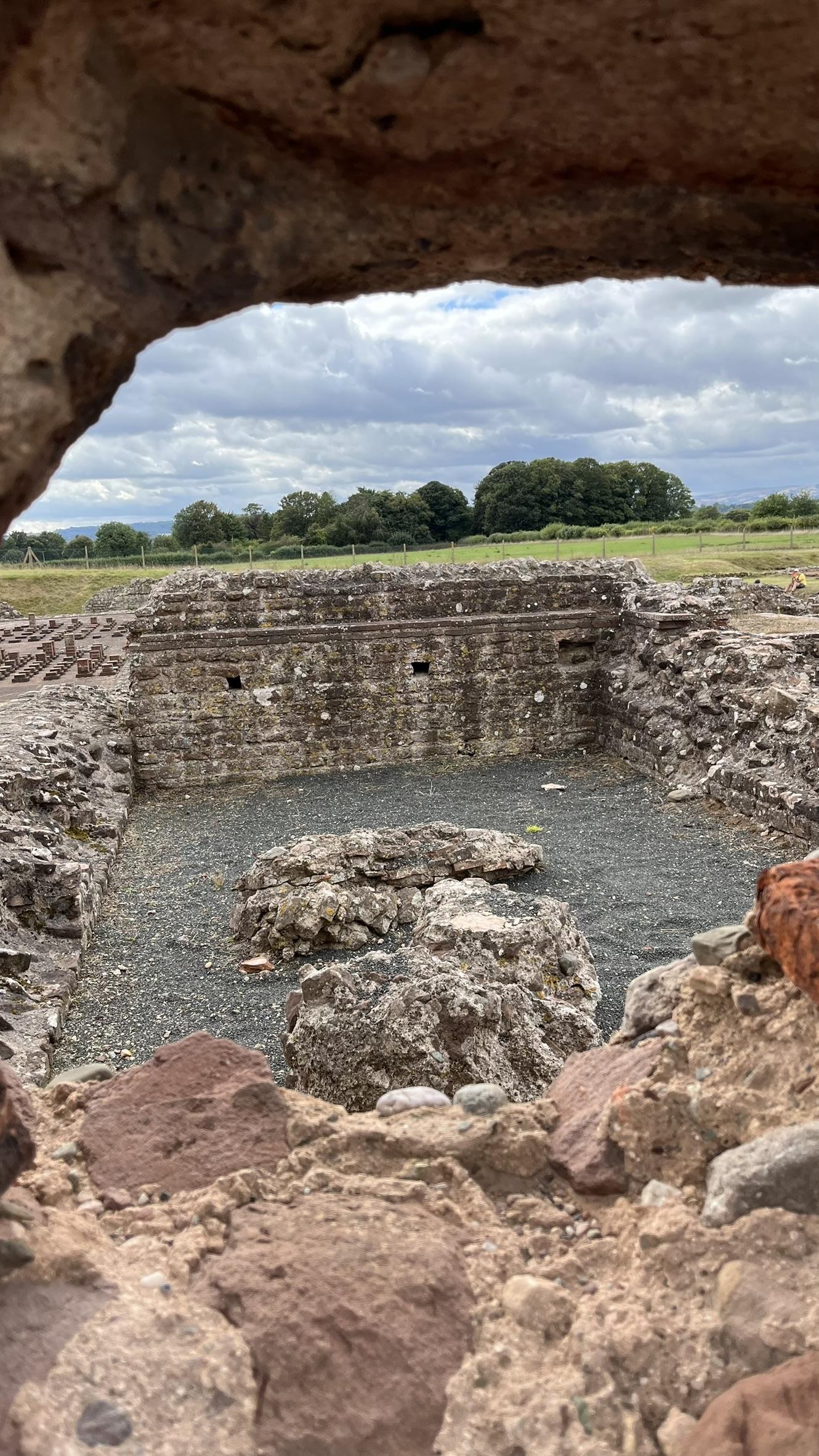 A view through a hole in the Basilica wall, looking into the bath house.