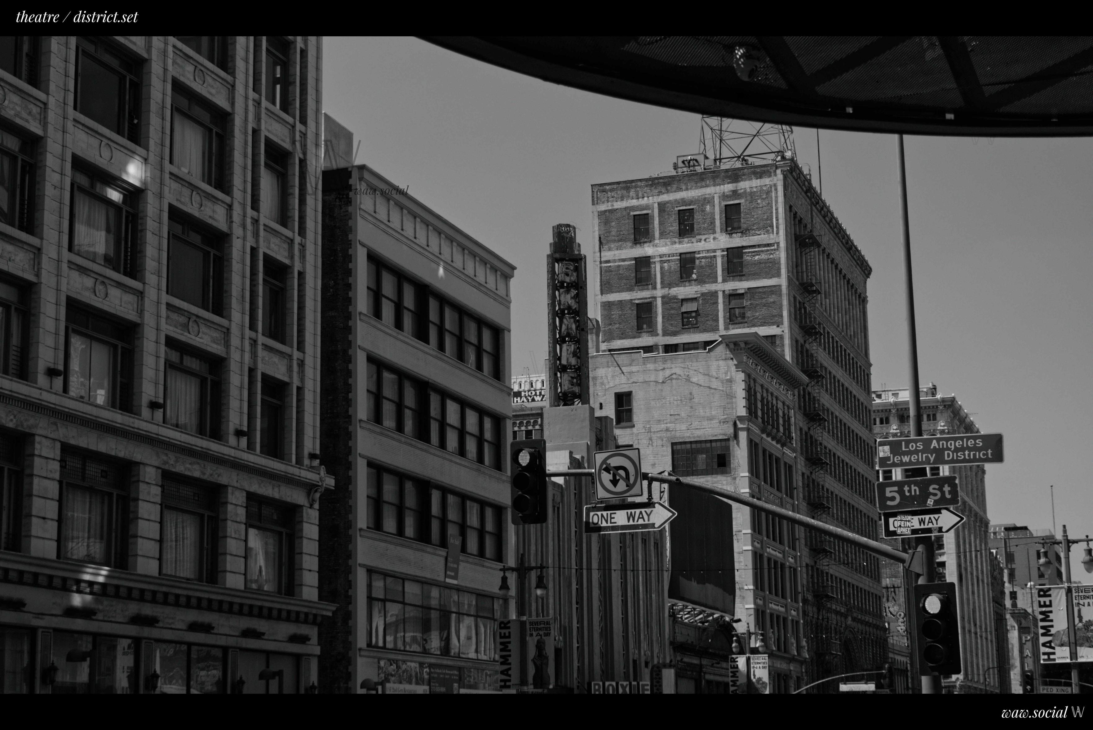 A black and white photo of the Theatre District in Downtown Los Angeles.