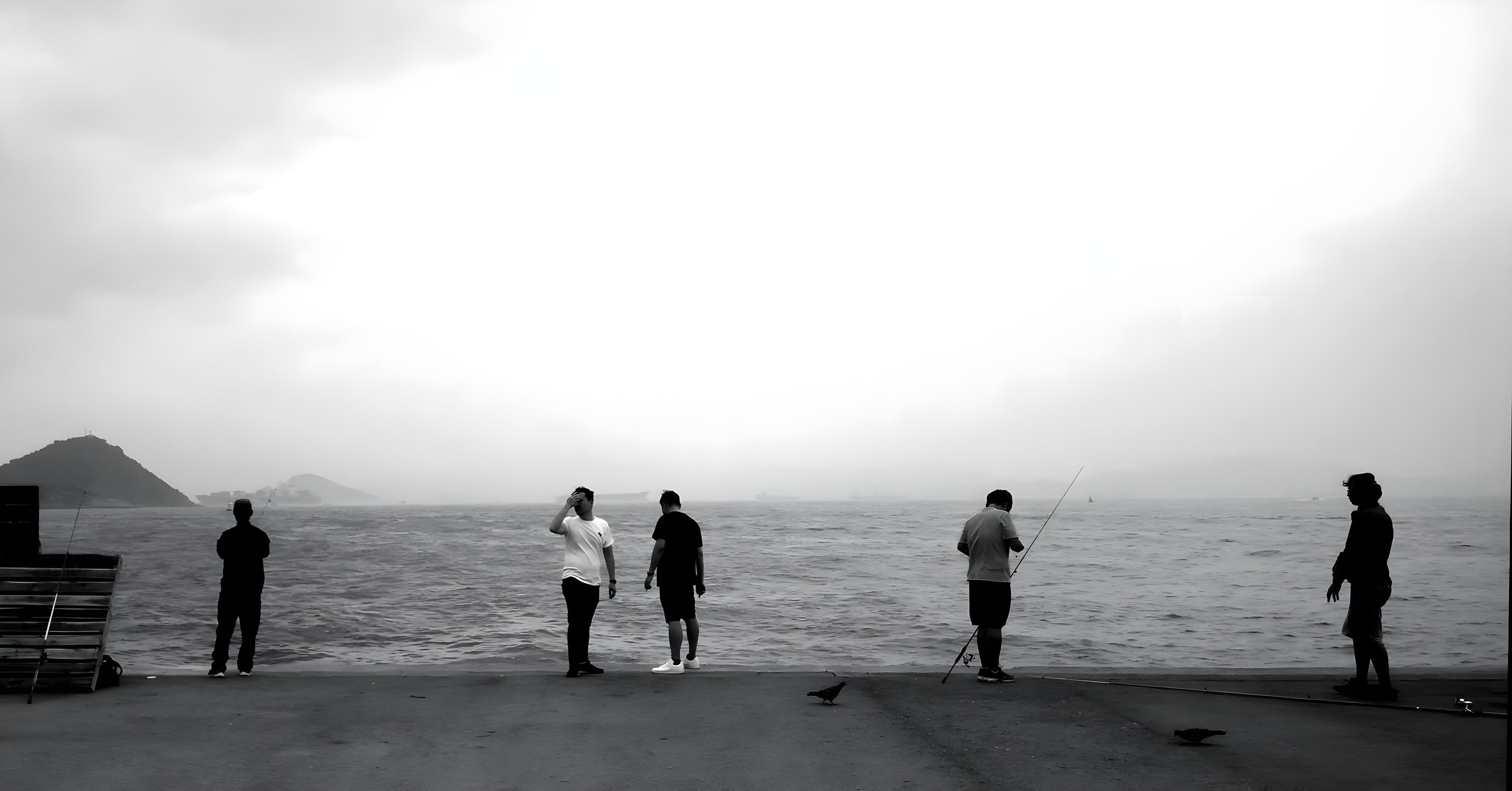 Waiting for that catch of the day at the edge of a pier.