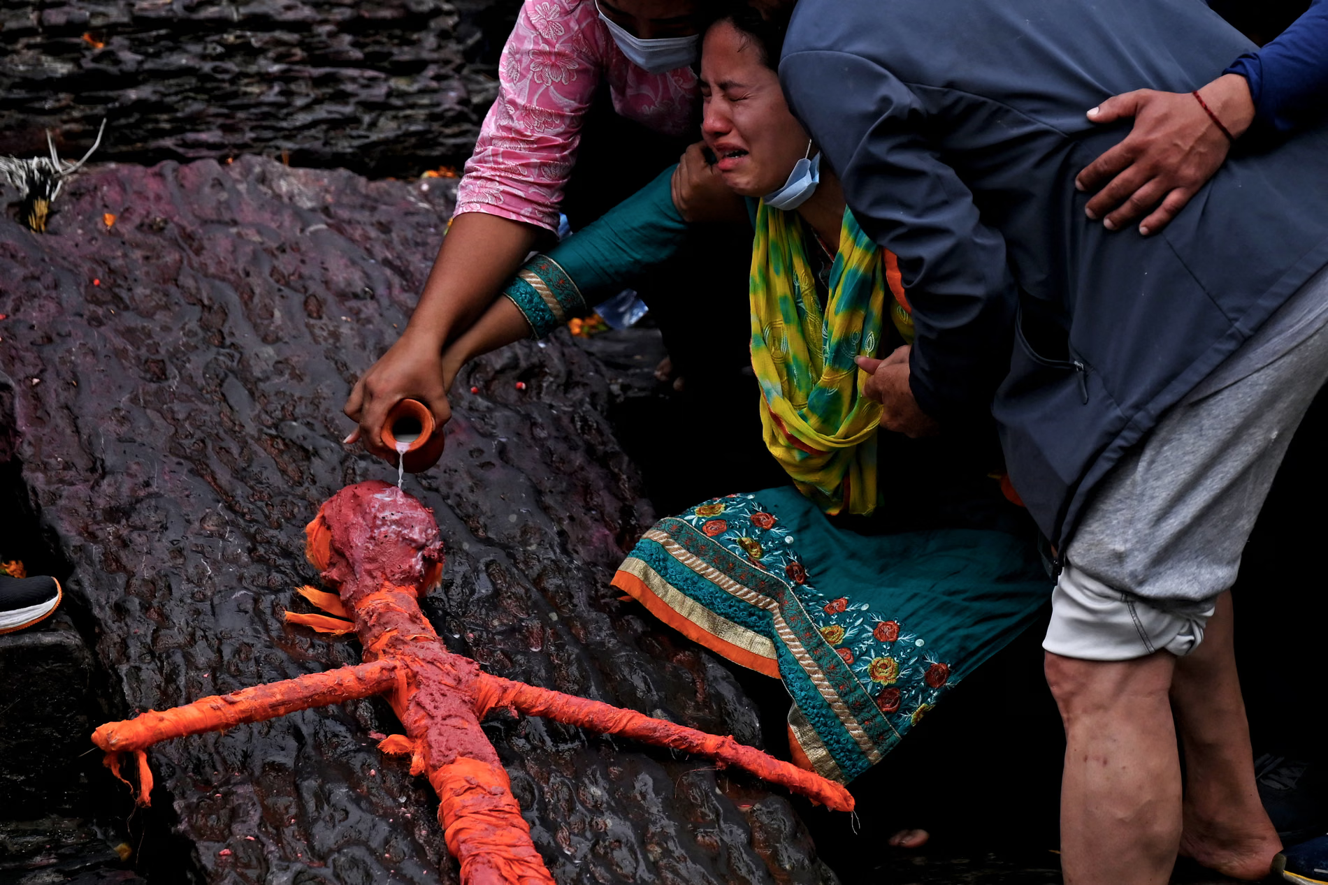 Symbolic funerals are conducted for missing relatives using kush grass effigies.