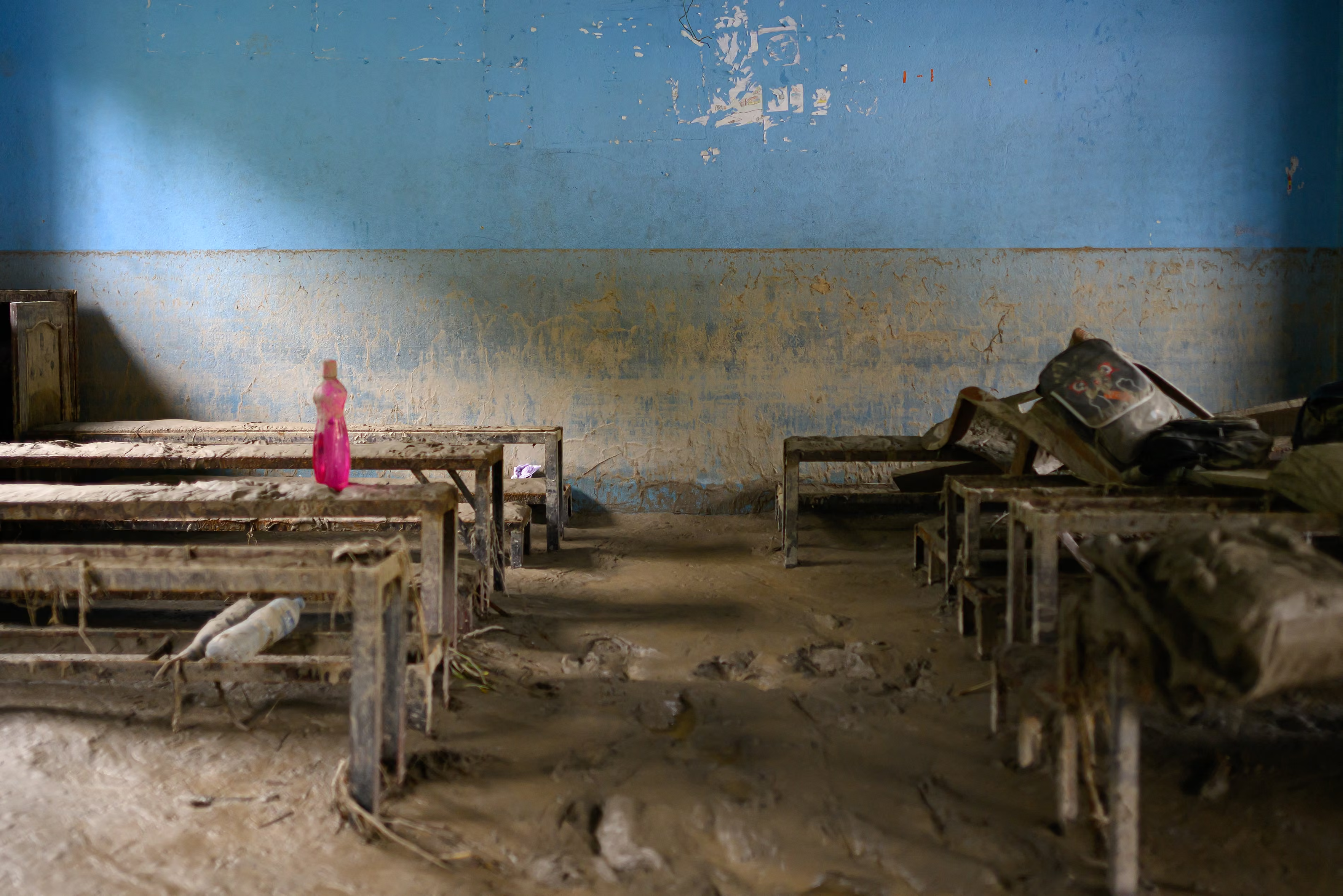 A mark shows the mud level on a wall in a classroom at Bageshwori secondary school after flash floods in Galchi.