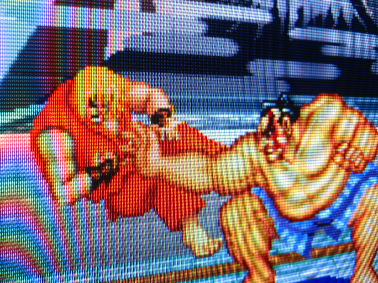Having rudely intruded upon the stoic sumo warrior E. Honda during his private-time in a traditional bathhouse, obnoxious westerner Ken Masters immediately receives the ass-whipping he deserves, courtesy Honda's signature Hundred Hand Slap.