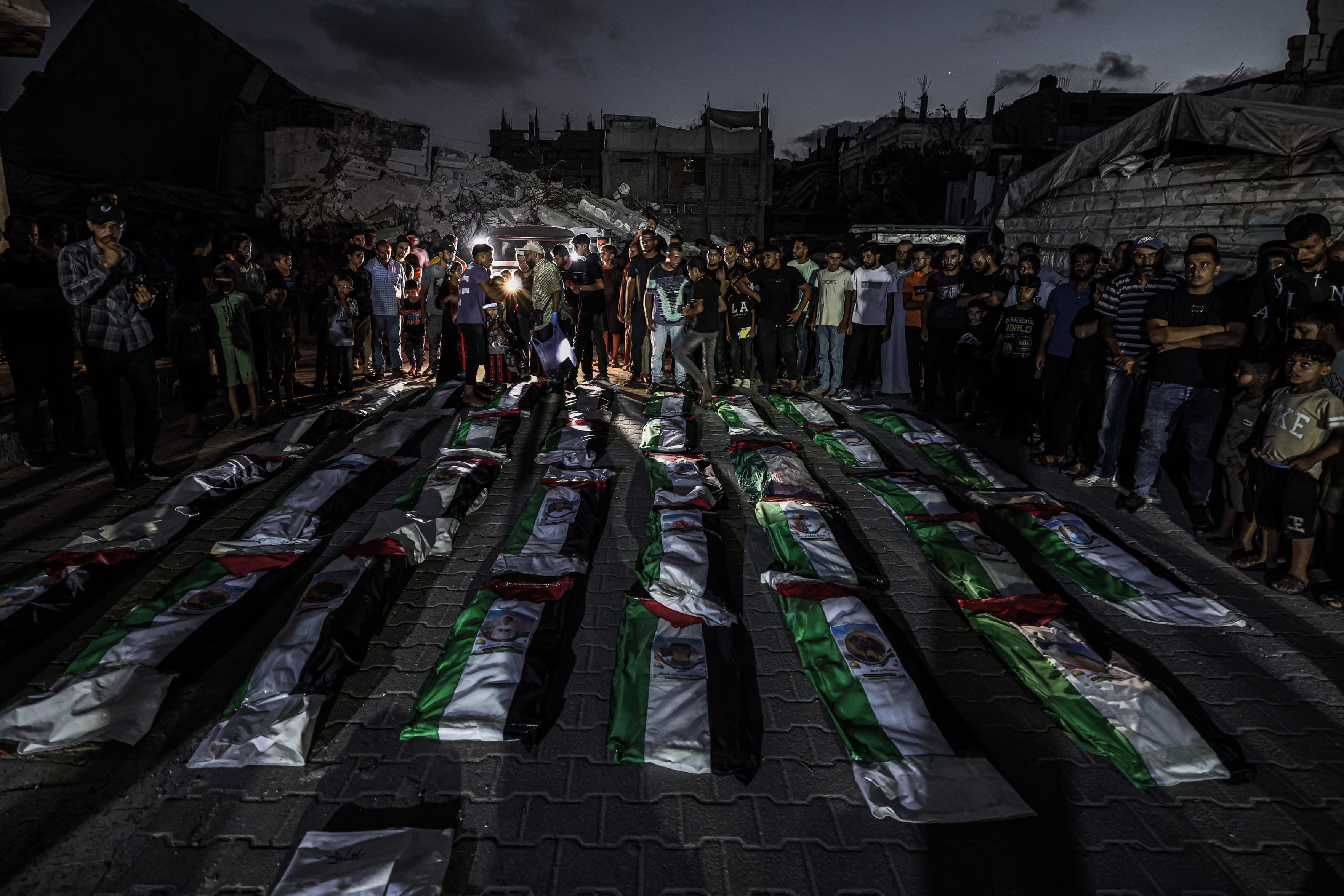 Mourners gathered at the funeral of 100 people.