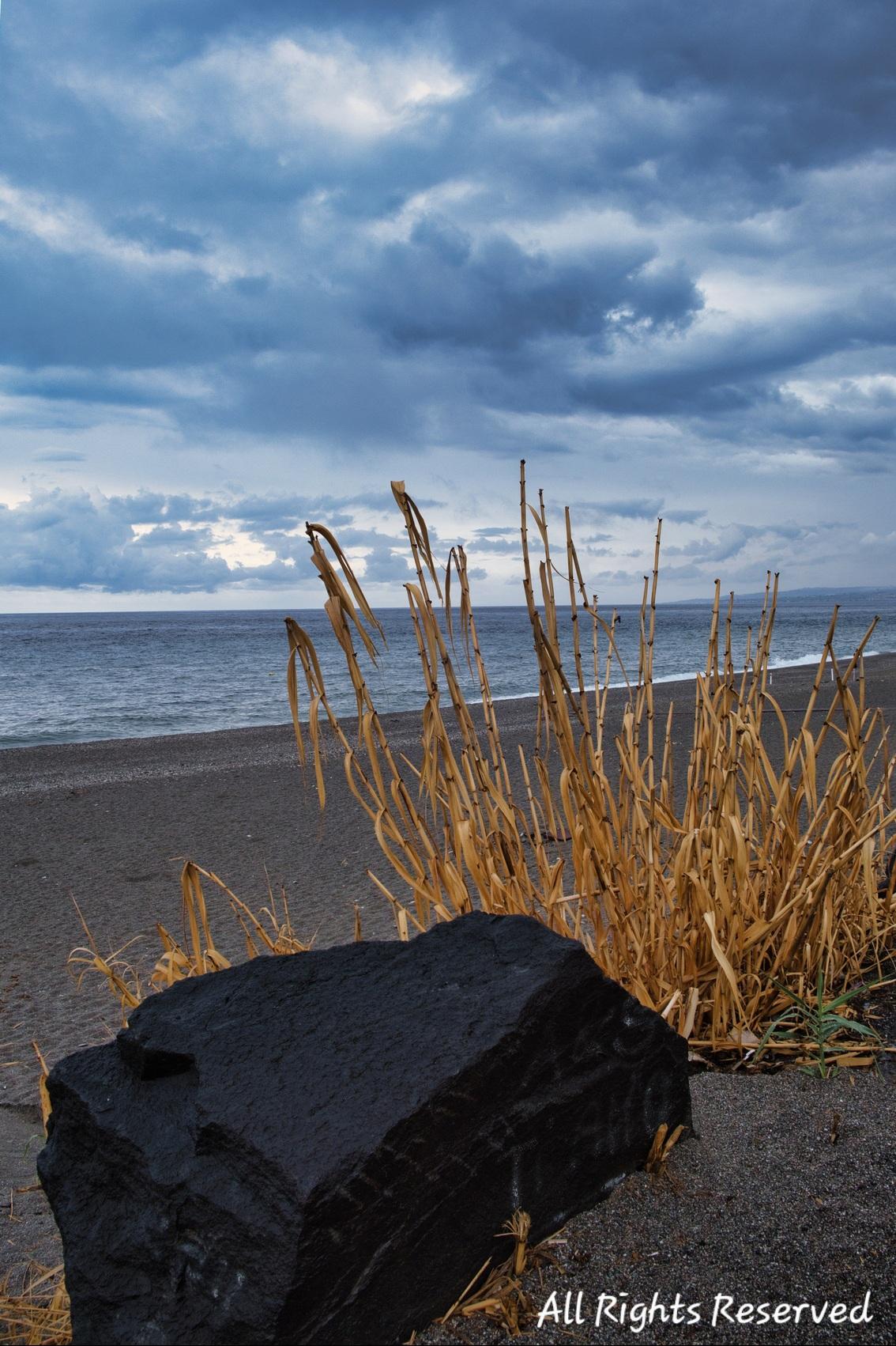 The colour contrast of the sky, the grass, and the volcanic rock, make for an interesting palette...