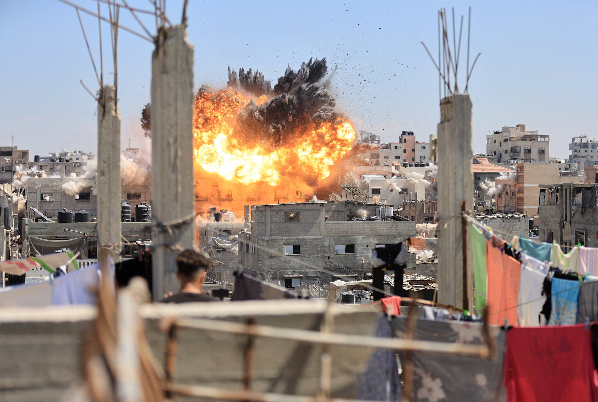 Smoke and flames rise from a house during an Israeli strike.