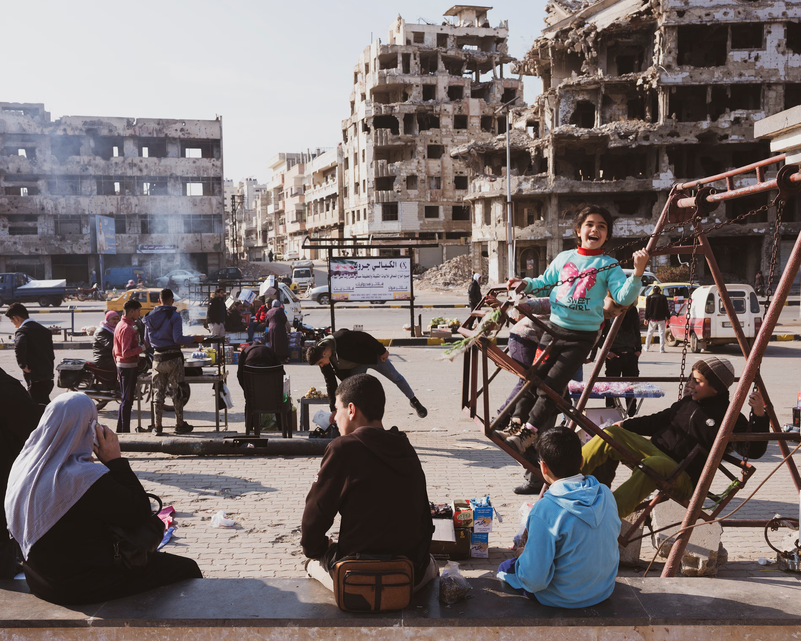 Children in a playground surrounded by ruins.

"... Returning was not just a physical journey; it was an emotional one. I wanted to reconnect with the streets, memories, people, and places from my past"