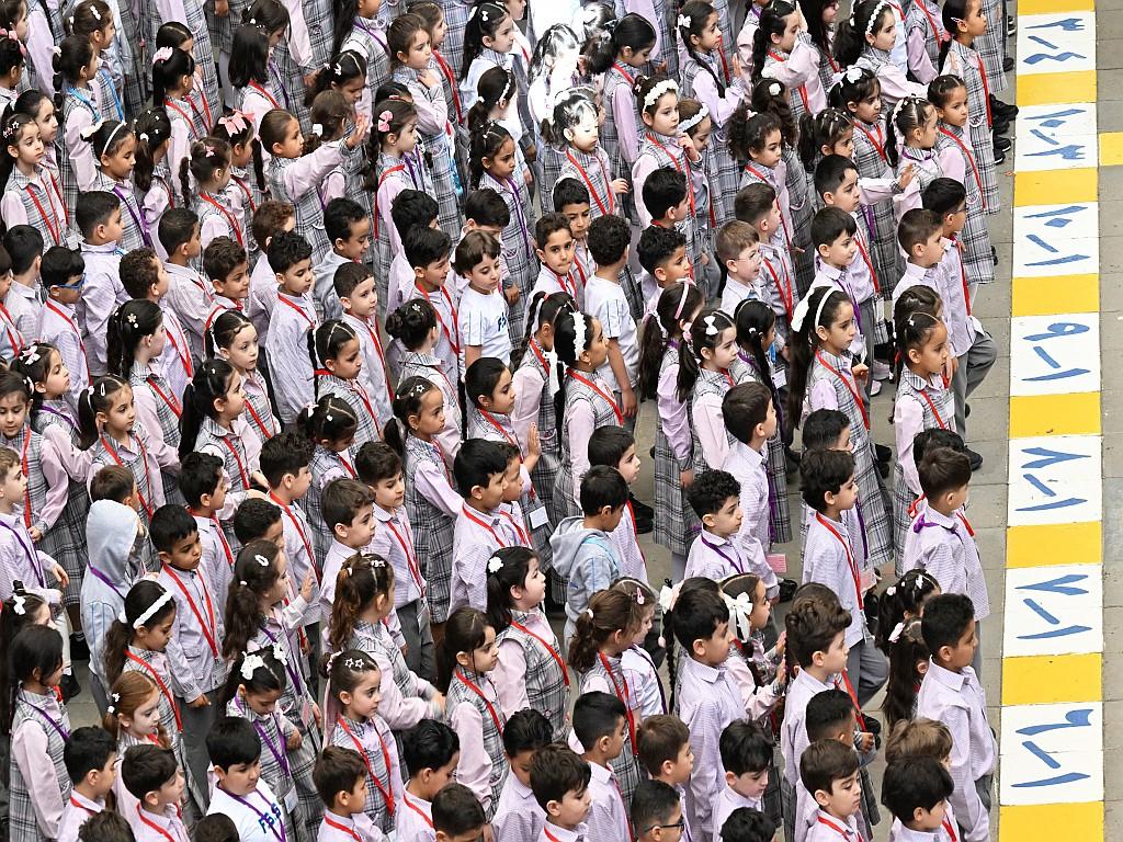 Students arrive for the first day of school.