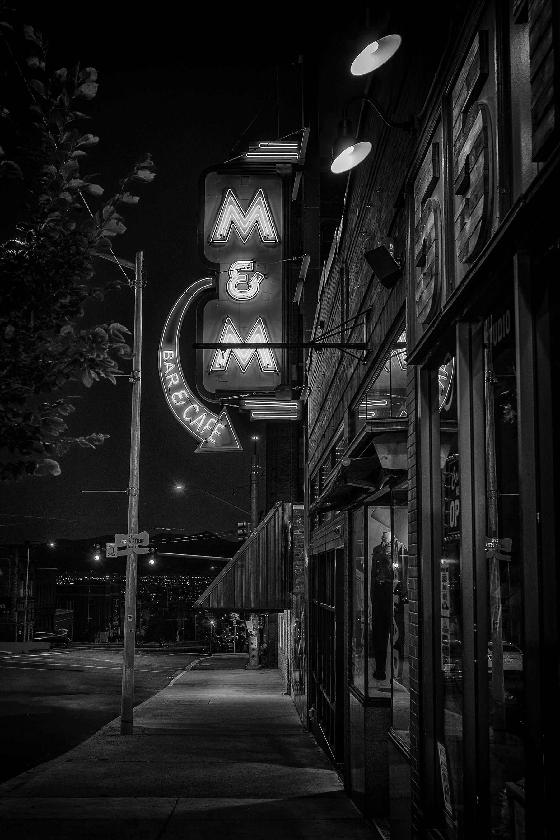 Sign for M&M bar and cafe by night in Butte, Montana. Unfortunately, the bar itself has burned down.