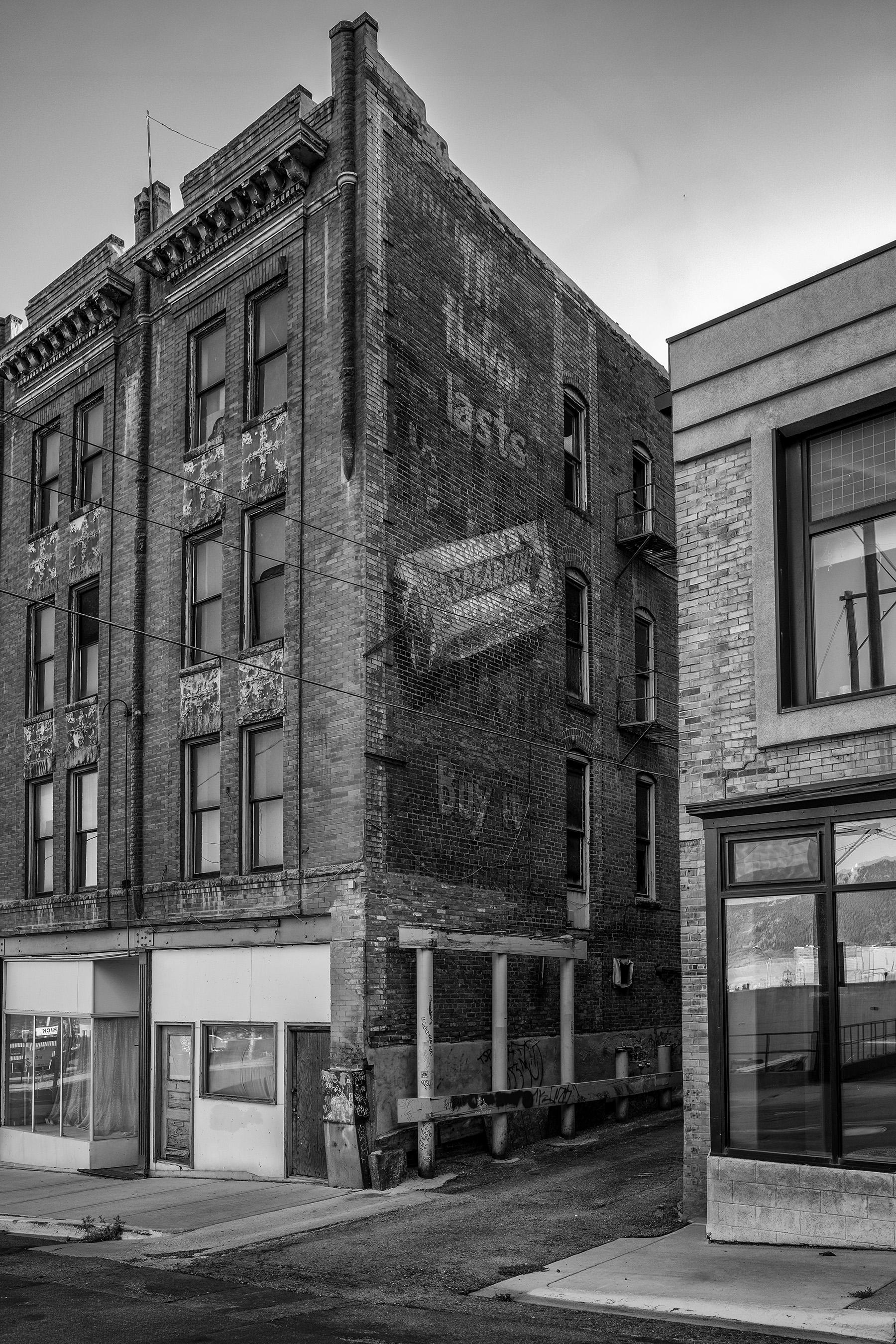 Old sign for Wrigley's gum on side of building in Butte, MT. Mention of pepsin on package dates it to the late 1910s.