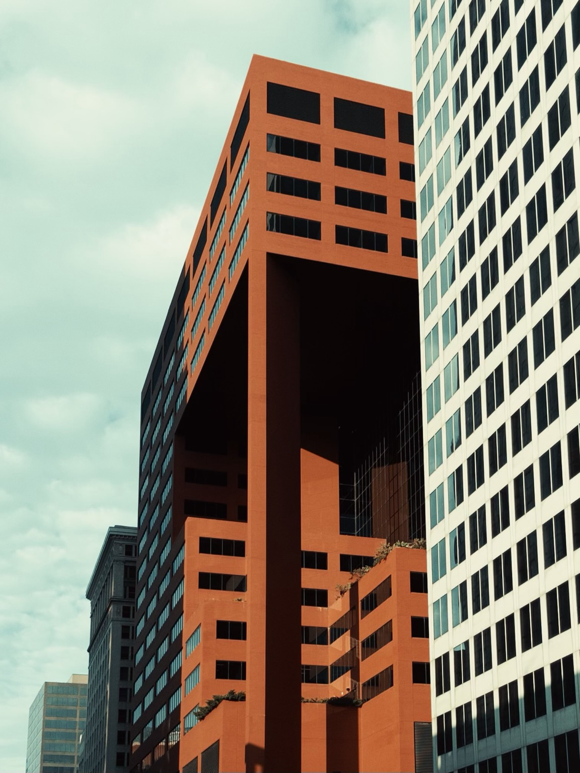 Overcast Day Downtown St Louis, Mo. Buildings towering over the street with their bold colors and sharp angles.