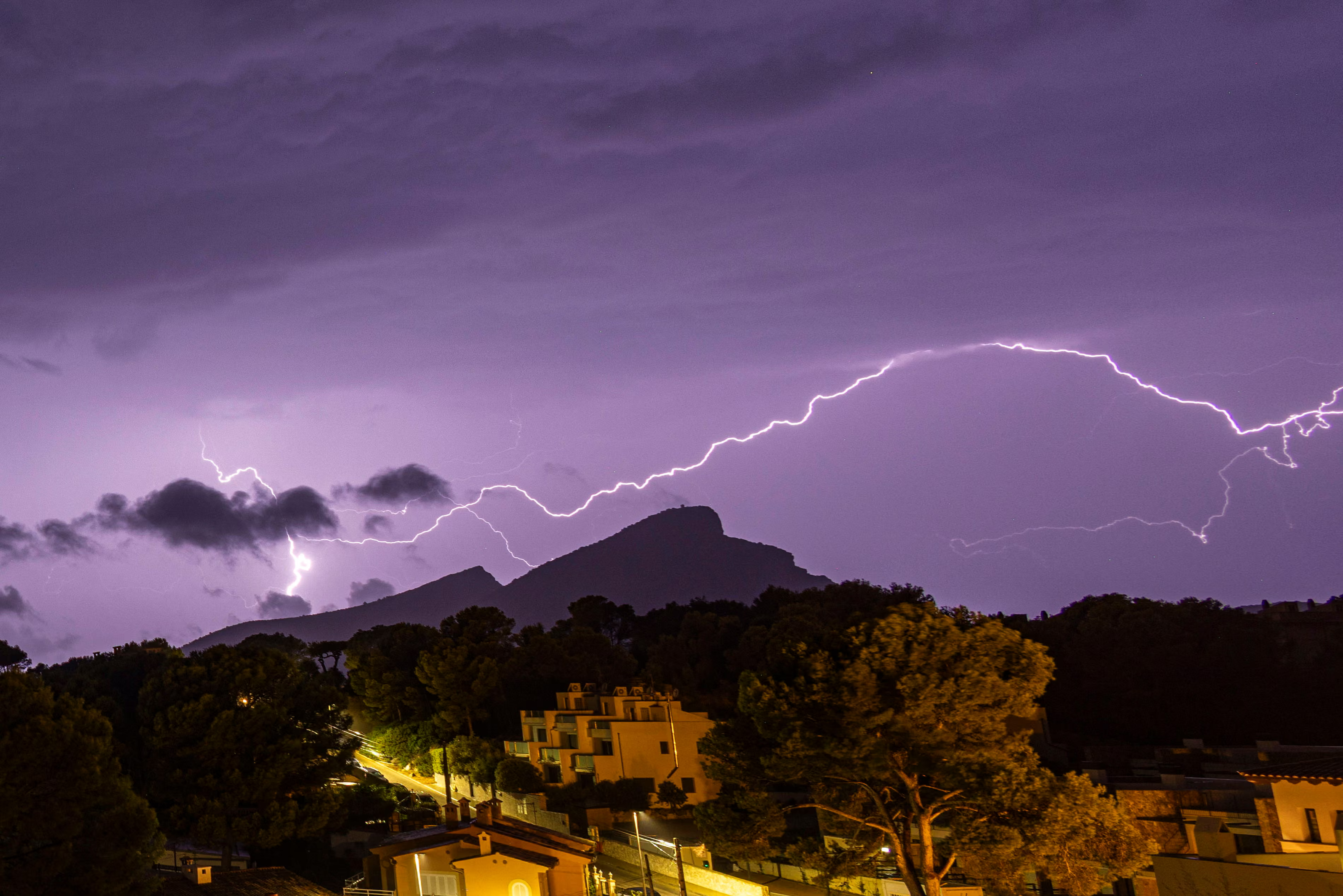 Lighting whips across the sky.