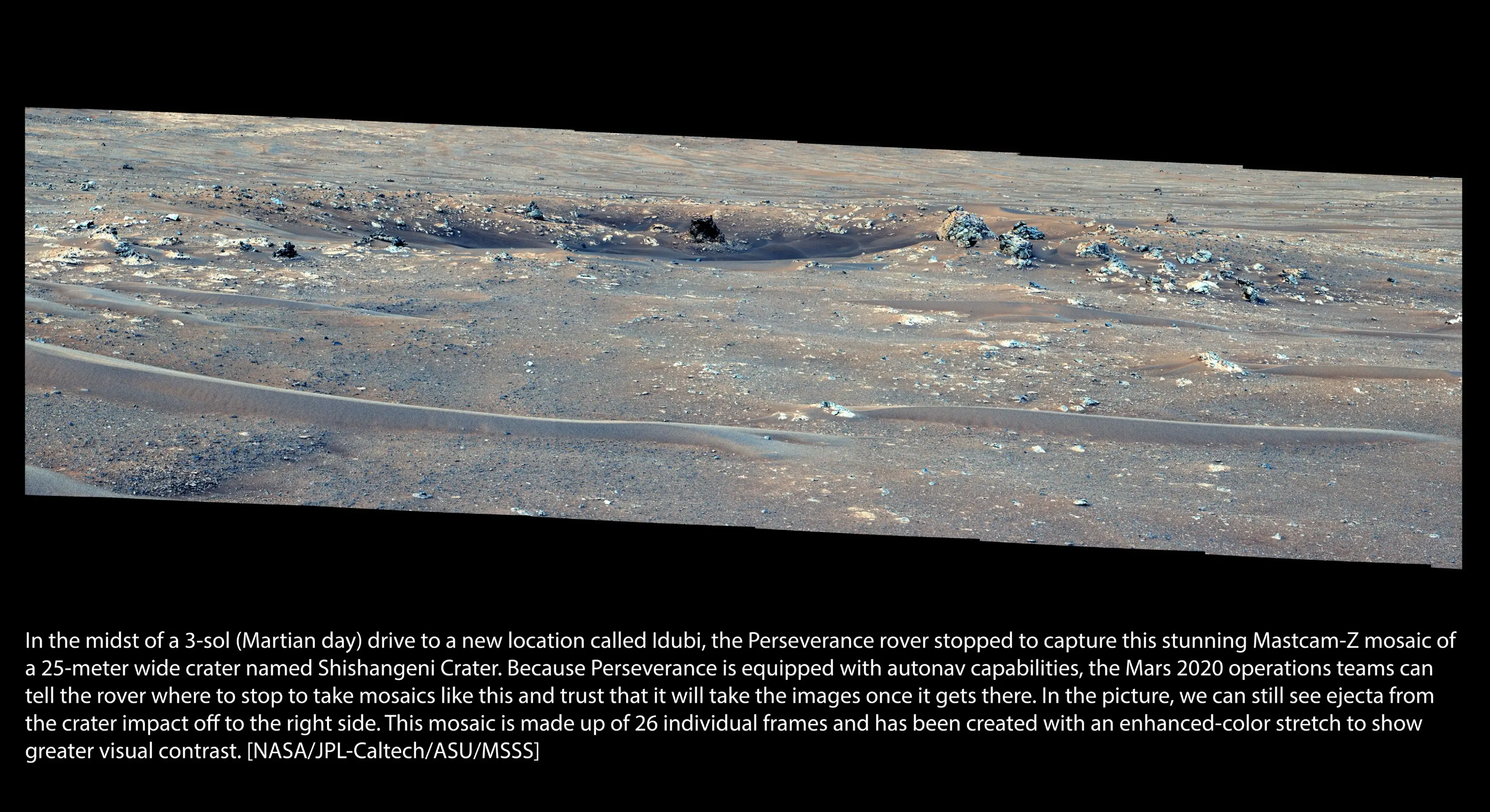 September 9, 2026: Pit stop! In the middle of a 3-sol (Martian day) drive to a new location called Idubi, the Perseverance rover made a stop to capture this stunning Mastcam-Z mosaic of Shishangeni Crater. Because Perseverance is equipped with auto-navigation capabilities, the Mars 2020 operations team can tell the rover where to stop during its drive to take mosaics like this and can trust the rover to take the images once it determines it’s where it needs to be.  In the picture, we can see ejecta from the 25-meter wide crater impact off to the right side. This mosaic is made up of 26 individual frames and has been created with an enhanced-color stretch to show greater visual contrast. Credit image: NASA/JPL-Caltech/ASU/MSSS. Credit text: Mastcam-Z Team.