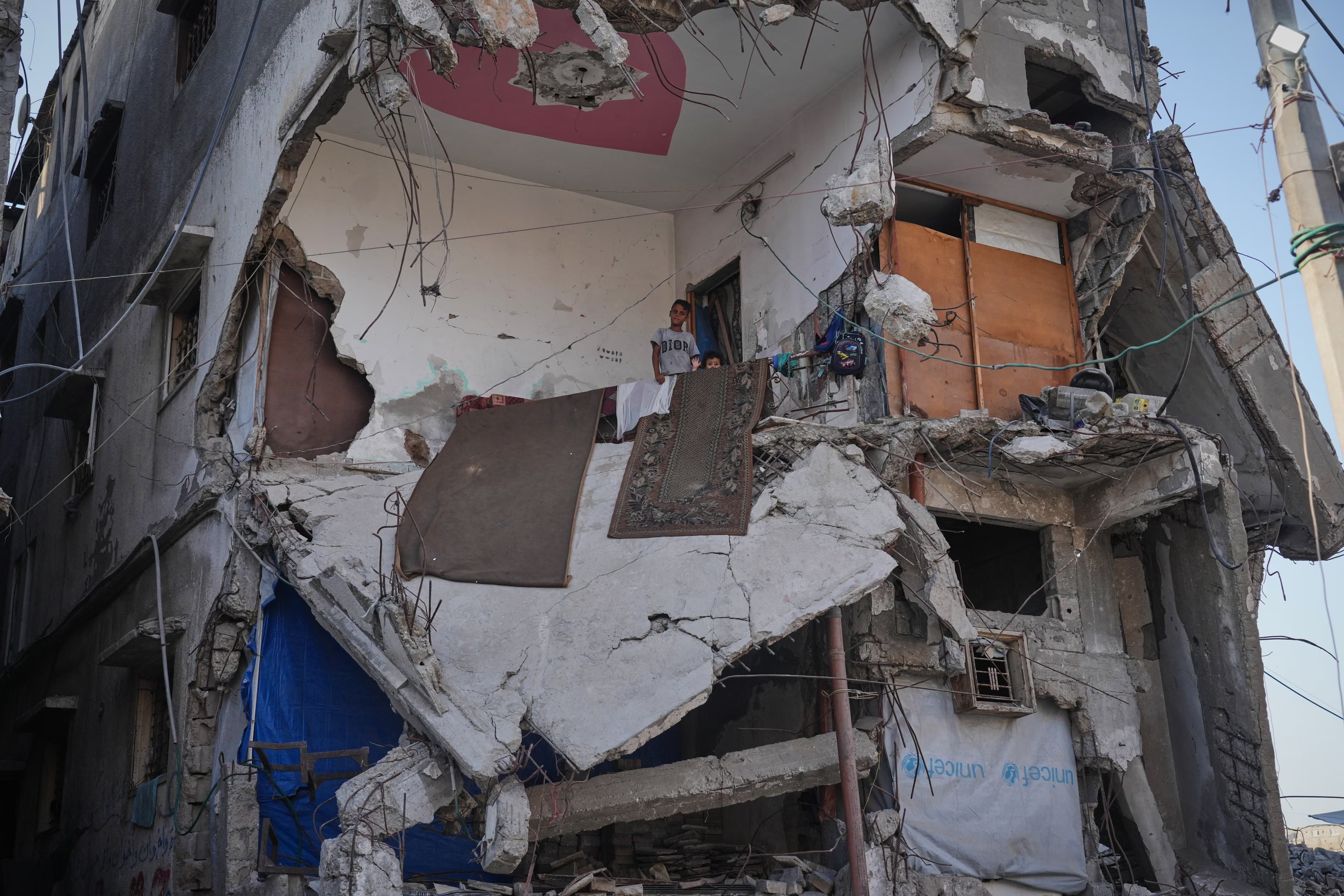 Displaced Palestinians shelter in a heavily damaged building in Gaza City.