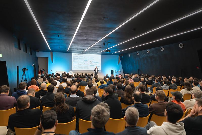 A group of people seated during a presentation given by a speaker at SFSCON25.