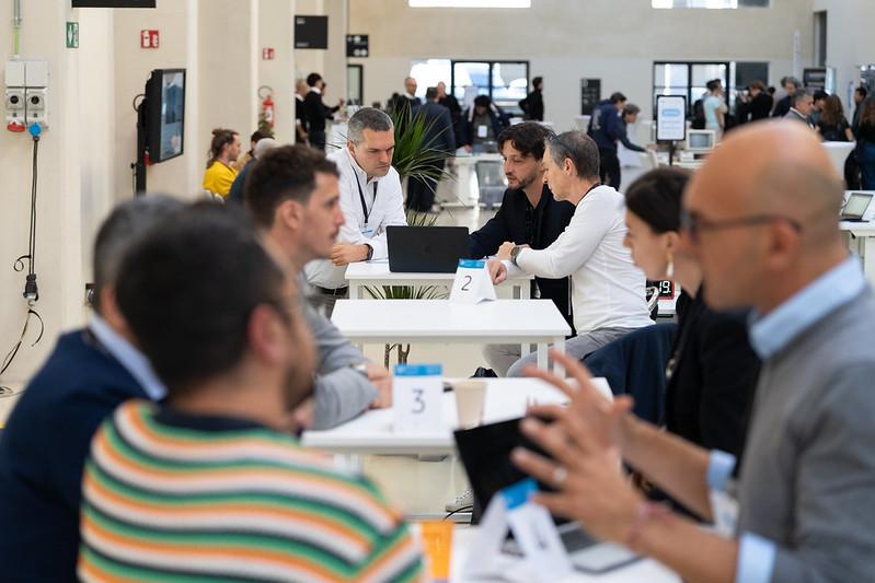 Groups of people sitting and talking during the B2B sessions at SFSCON25.
